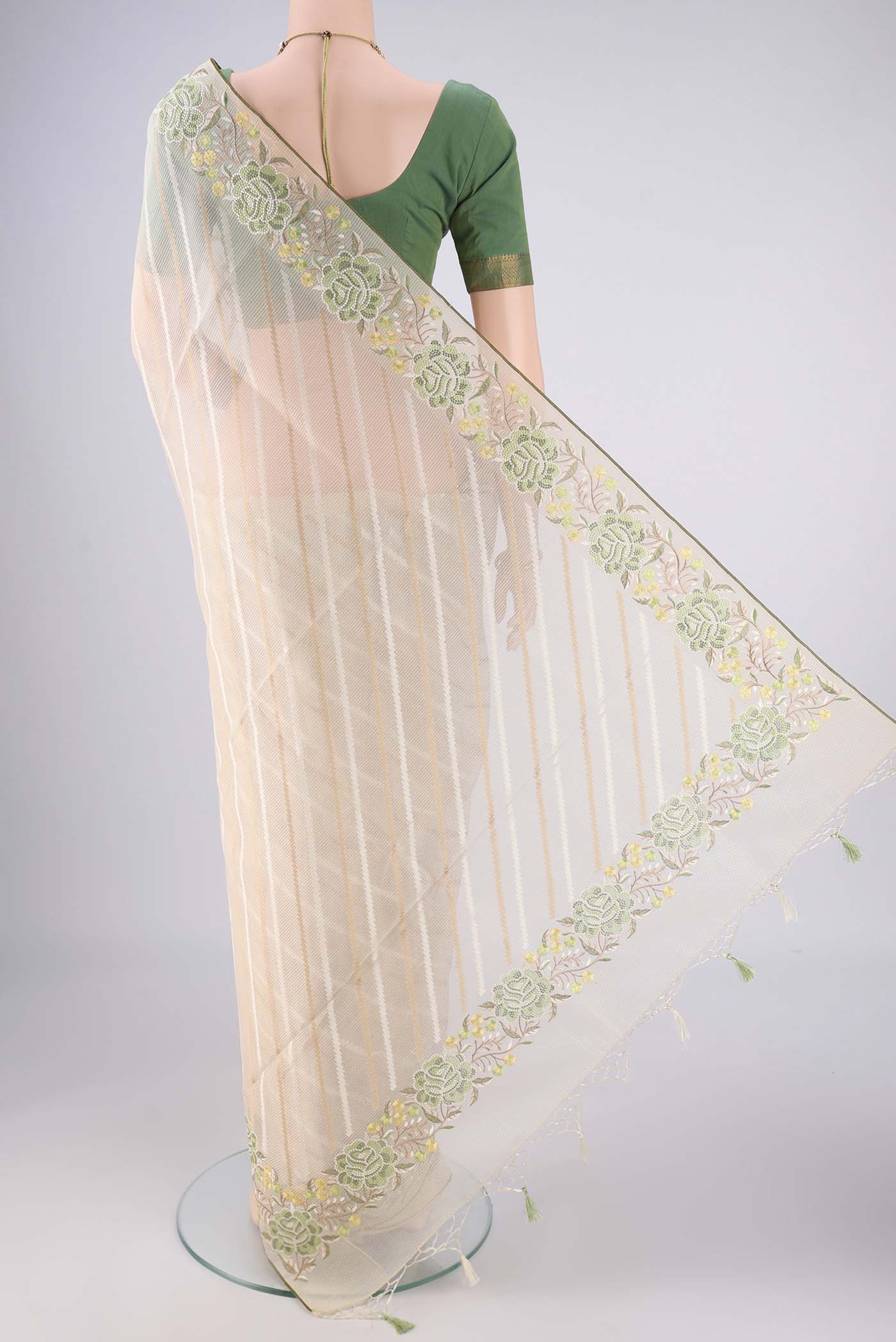 Flat view of Cream Blended Kota Cotton Saree with Stripes on the body and Embroidery Border. 