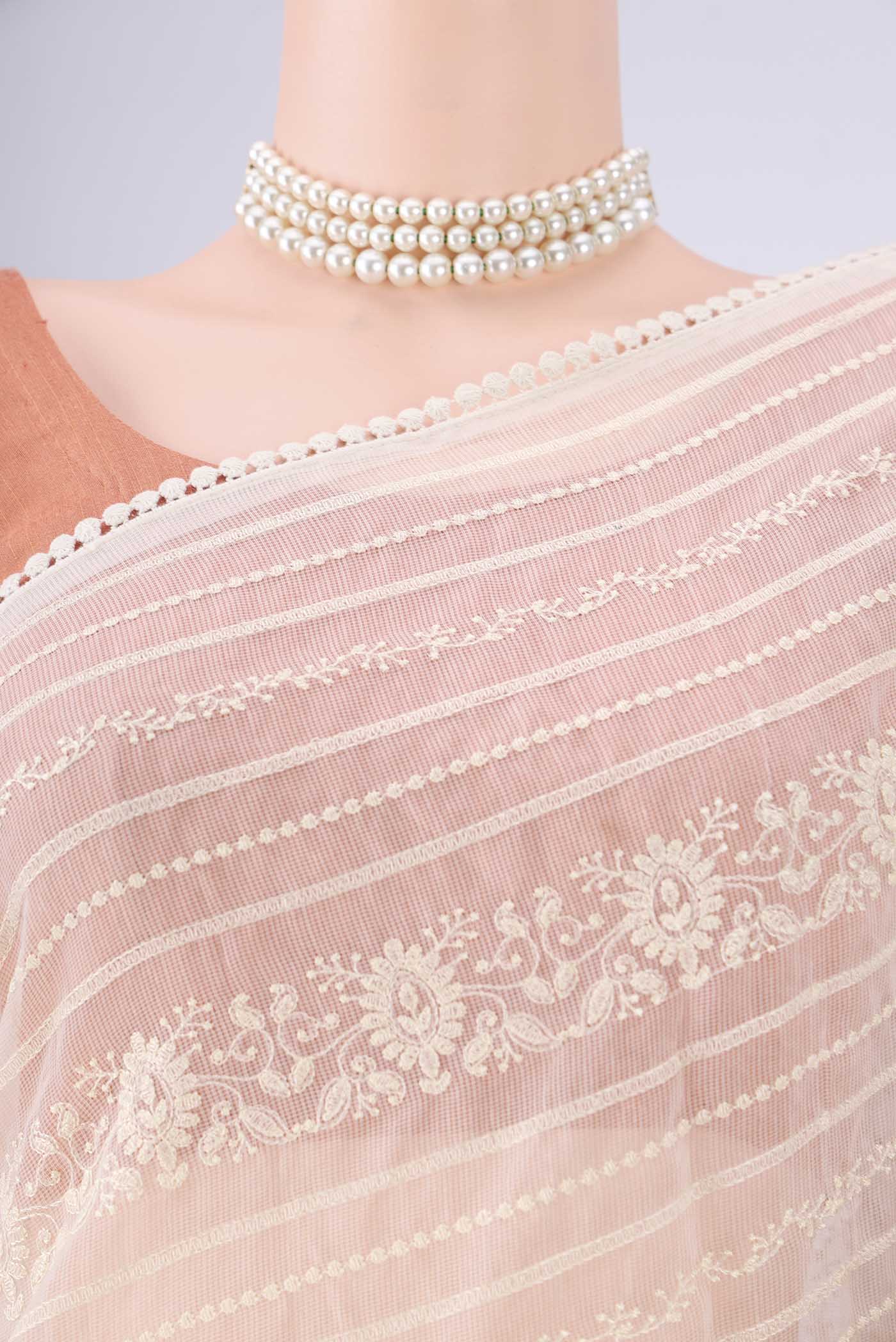 Border image of Off White Blended Kota Cotton Saree with Printed design on the body and Embroidery Border. 