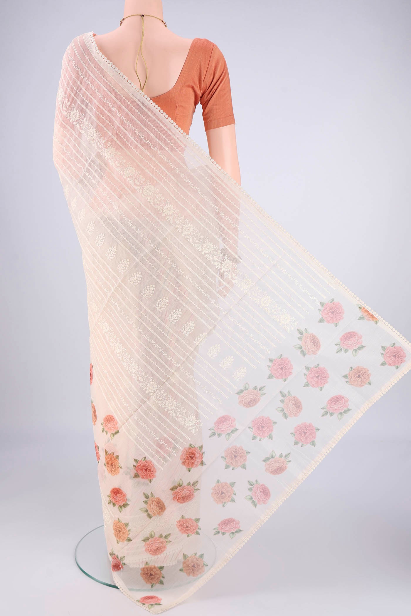 Flat view of Off White Blended Kota Cotton Saree with Printed design on the body and Embroidery Border. 