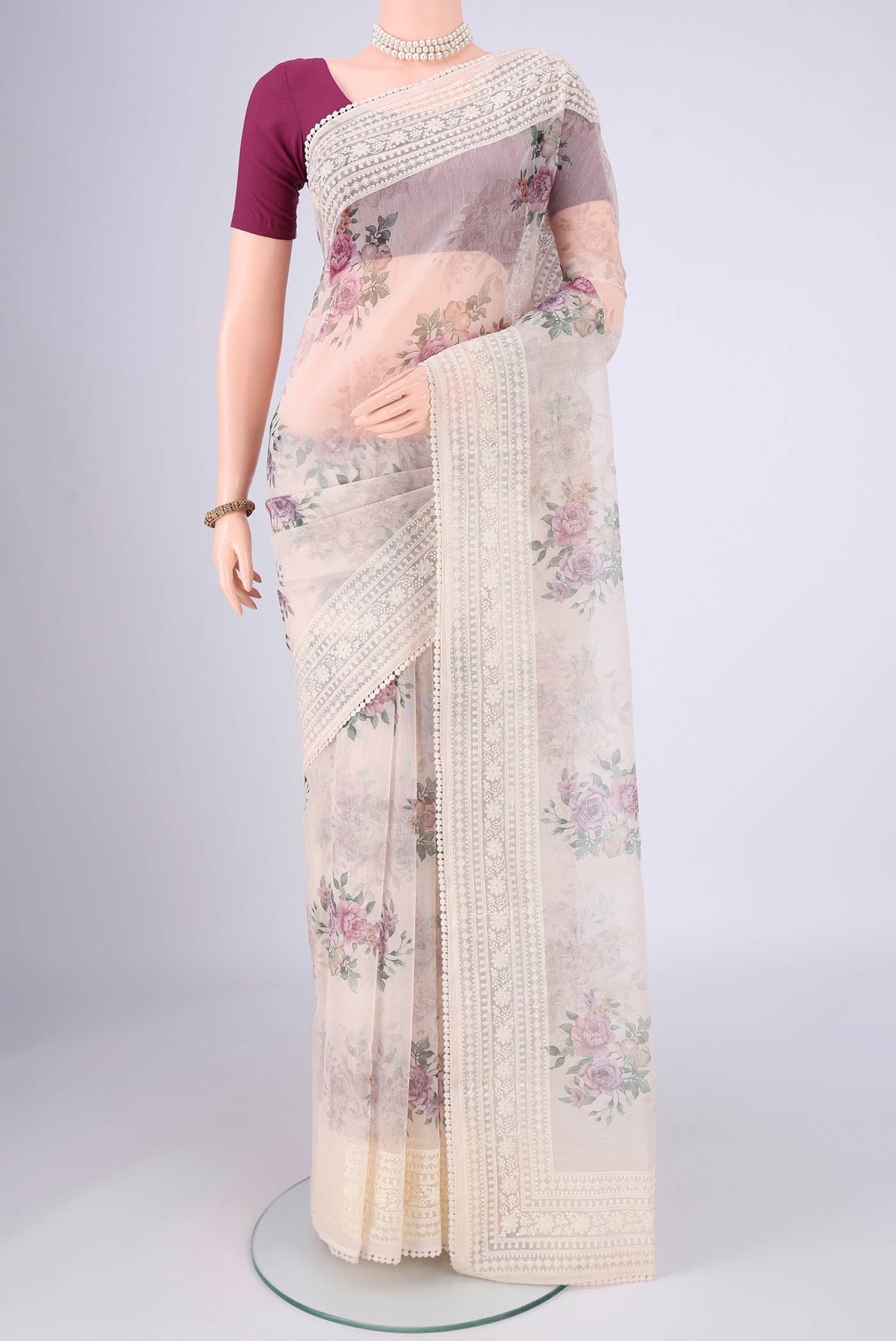 Off White Blended Kota Cotton Saree with Embroidery on the body and Embroidery Border.  displayed on a mannequin