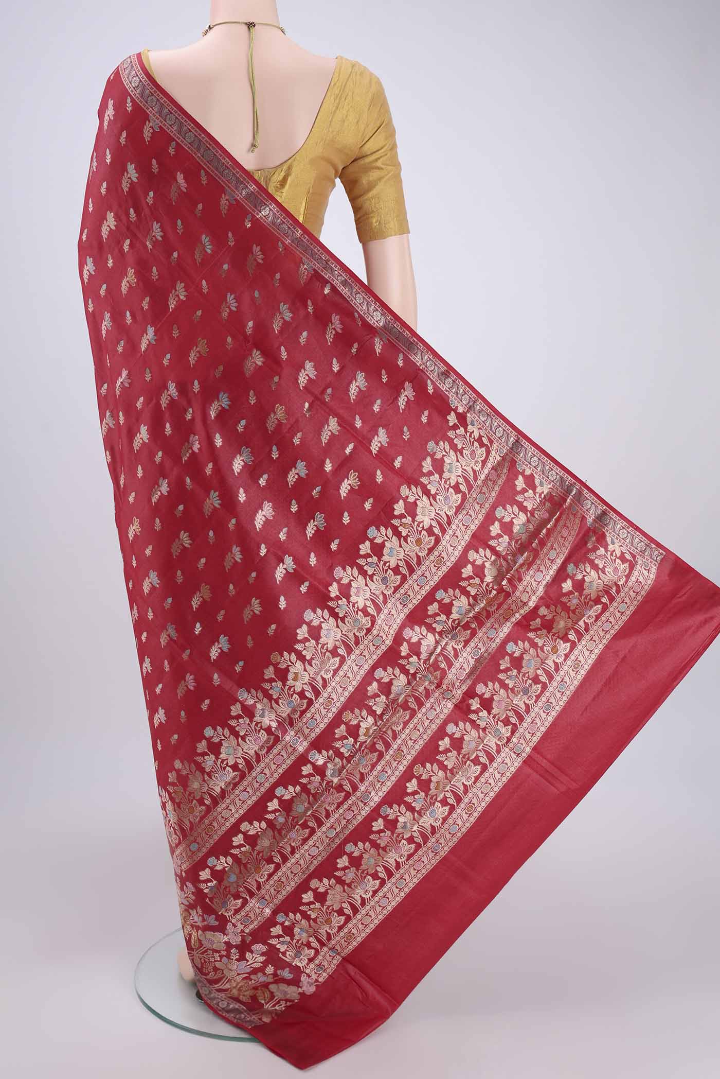 Flat view of Orange Banarasi Tussar Silk Saree with Thread Brocade on the body and Zari And Thread Border. 