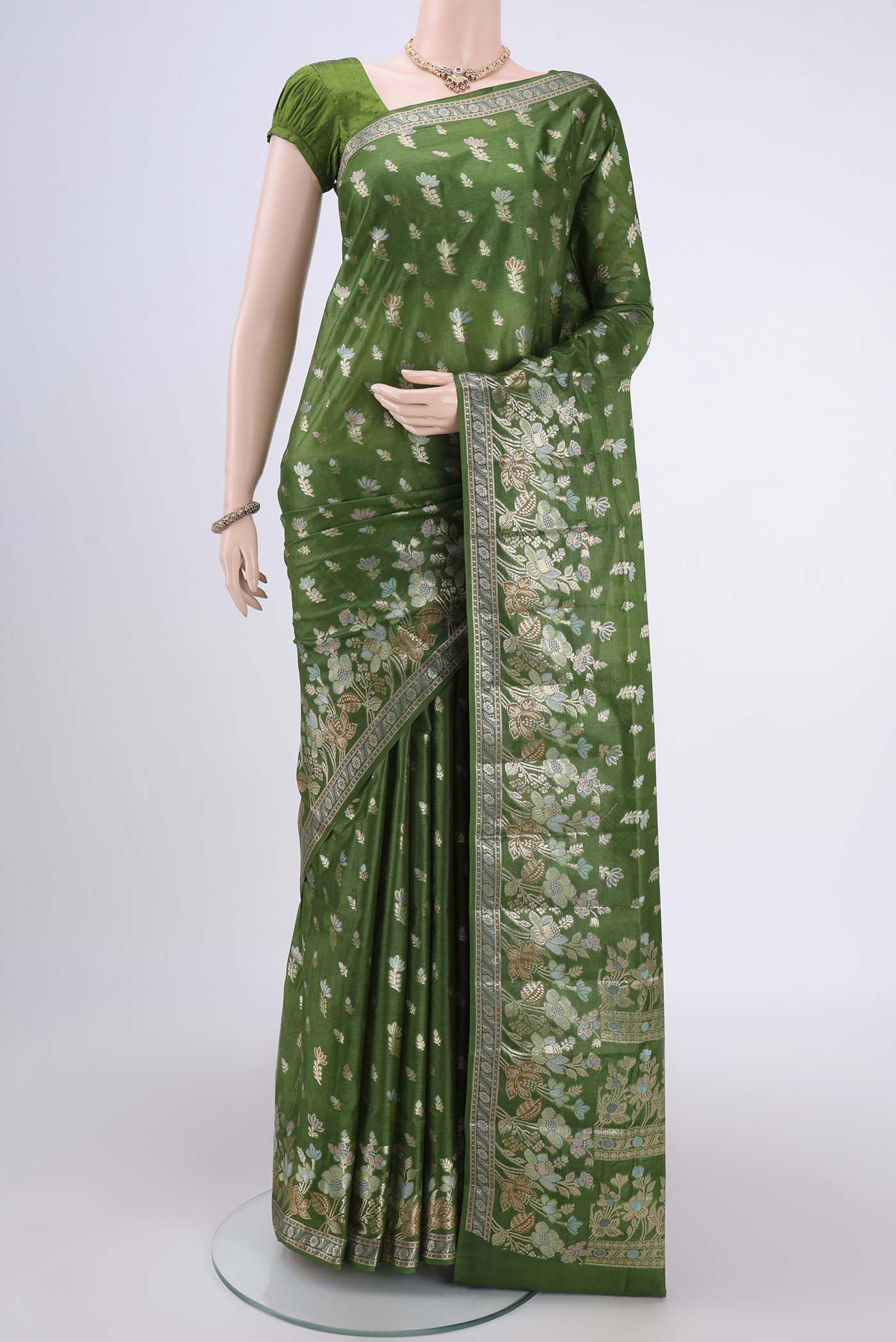 Mehandi Green Banarasi Tussar Silk Saree with Zari And Thread Butta on the body and Zari And Thread Border.  displayed on a mannequin