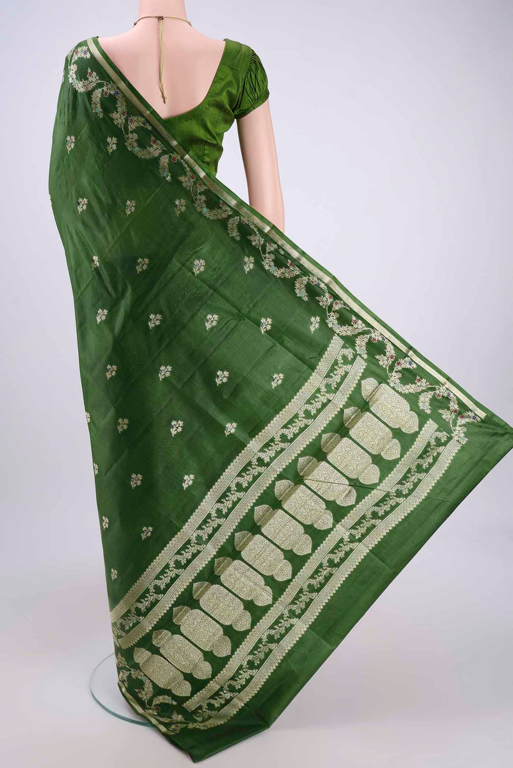 Flat view of Green Banarasi Tussar Silk Saree with Zari And Thread Butta on the body and Zari And Thread Border. 