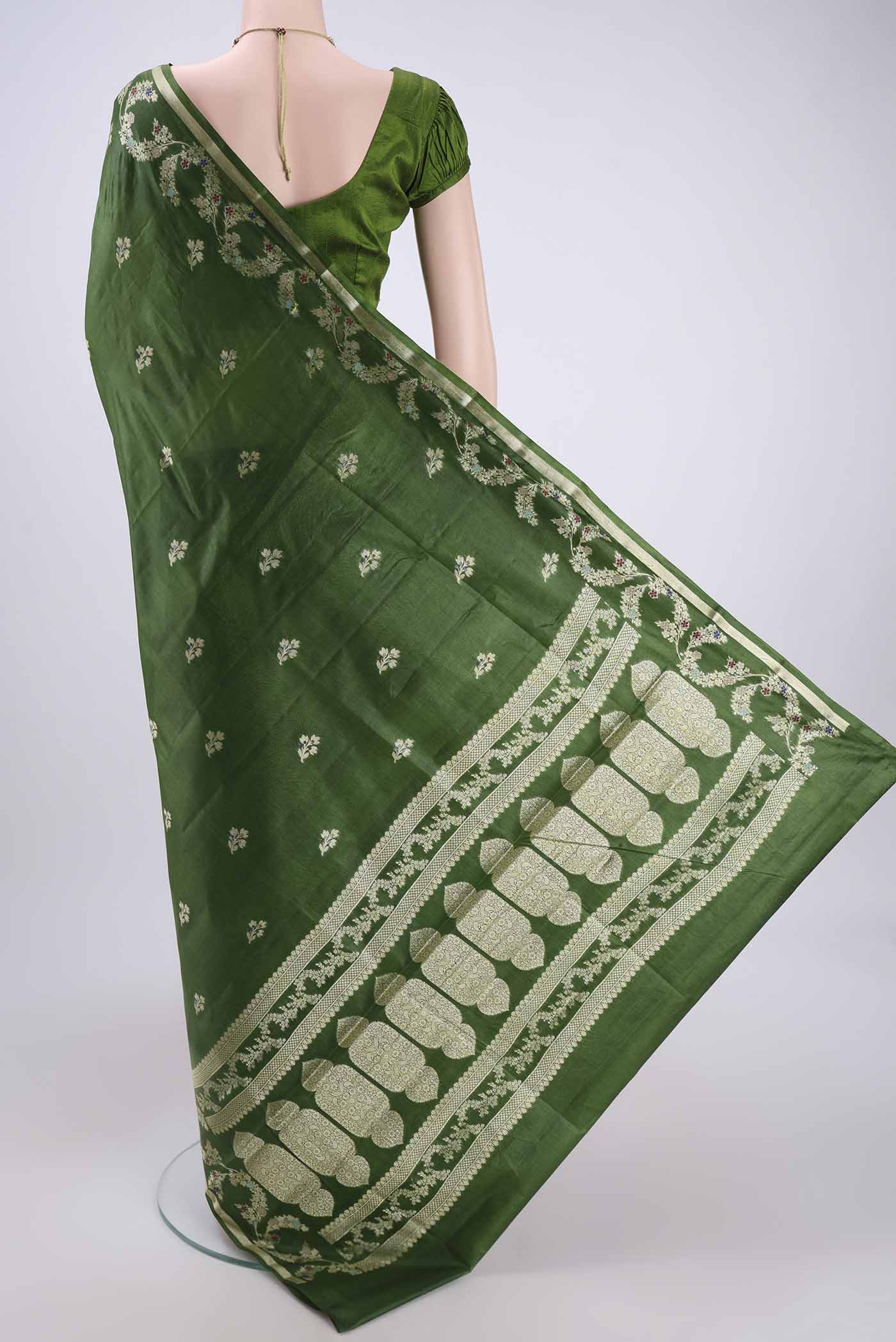 Flat view of Green Banarasi Tussar Silk Saree with Zari And Thread Butta on the body and Zari And Thread Border. 
