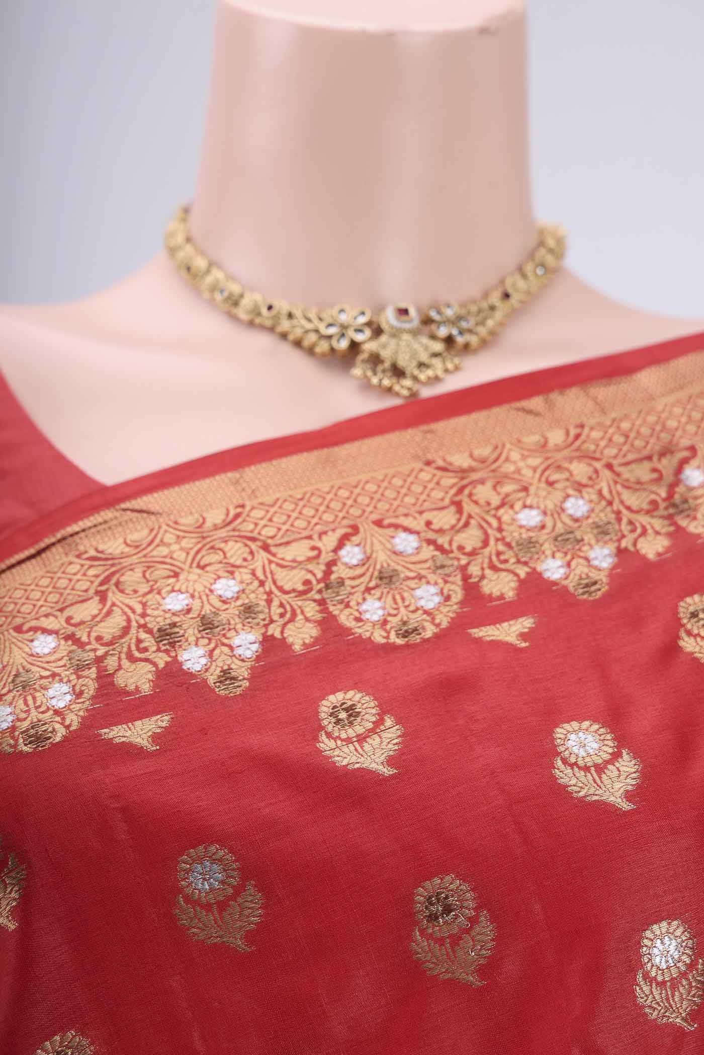 Border image of Orange Banarasi Tussar Silk Saree with Zari And Thread Butta on the body and Zari And Thread Border. 