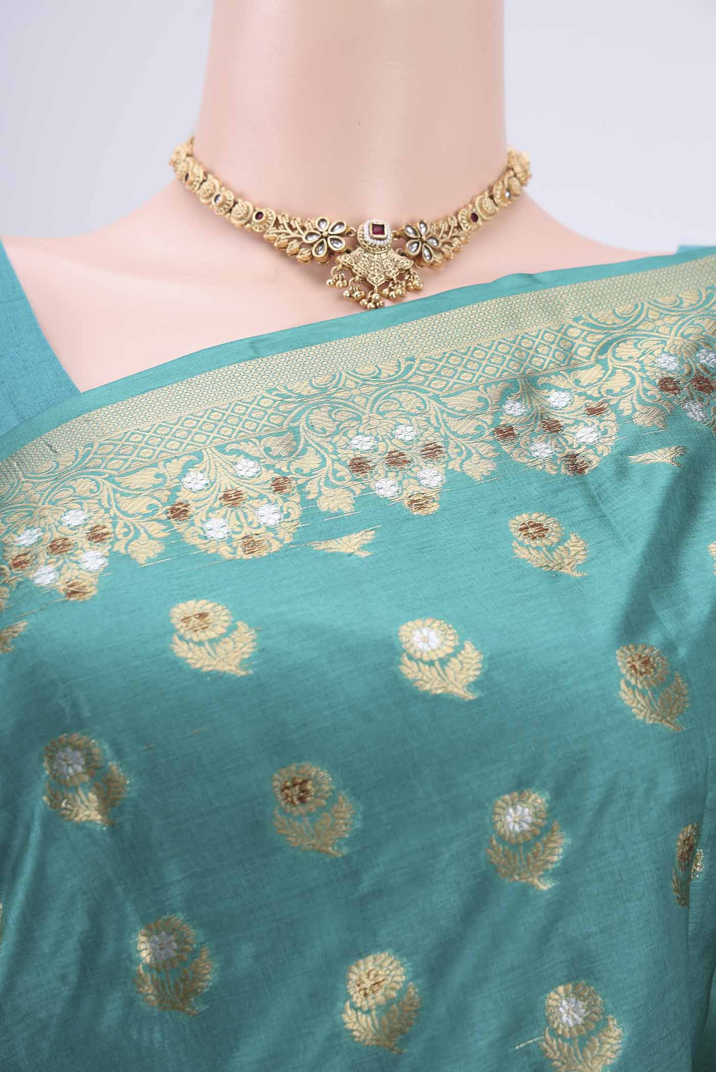 Border image of Turquoise Banarasi Tussar Silk Saree with Zari And Thread Butta on the body and Zari And Thread Border. 