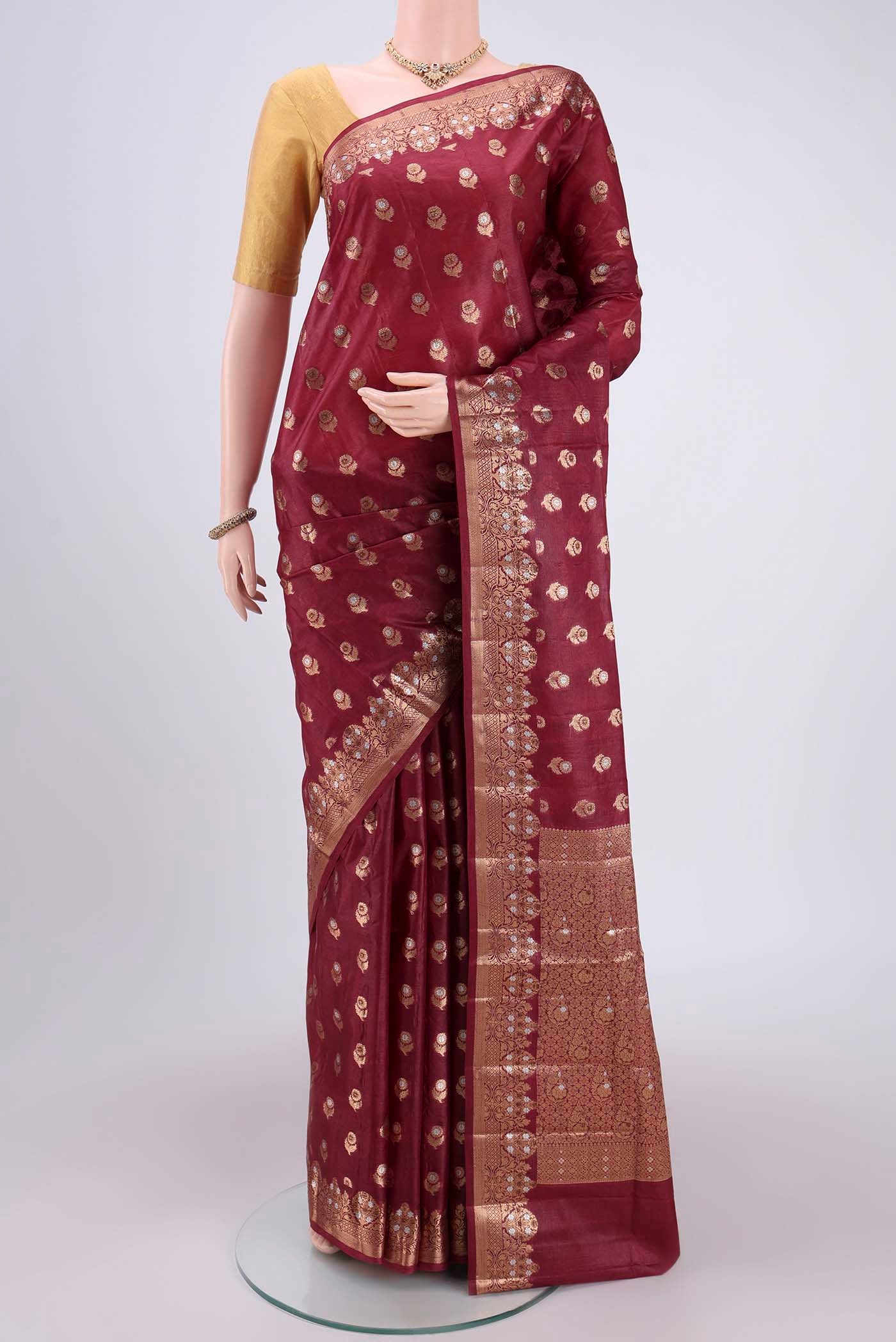 Coffee Brown Banarasi Tussar Silk Saree with Thread Brocade on the body and Zari And Thread Border.  displayed on a mannequin