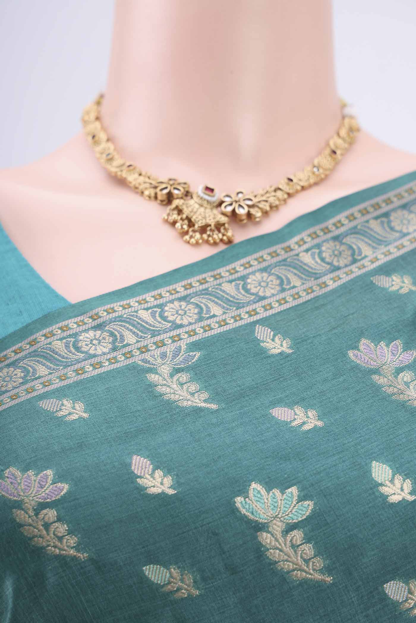 Border image of Sea Green Banarasi Tussar Silk Saree with Zari And Thread Butta on the body and Zari And Thread Border. 
