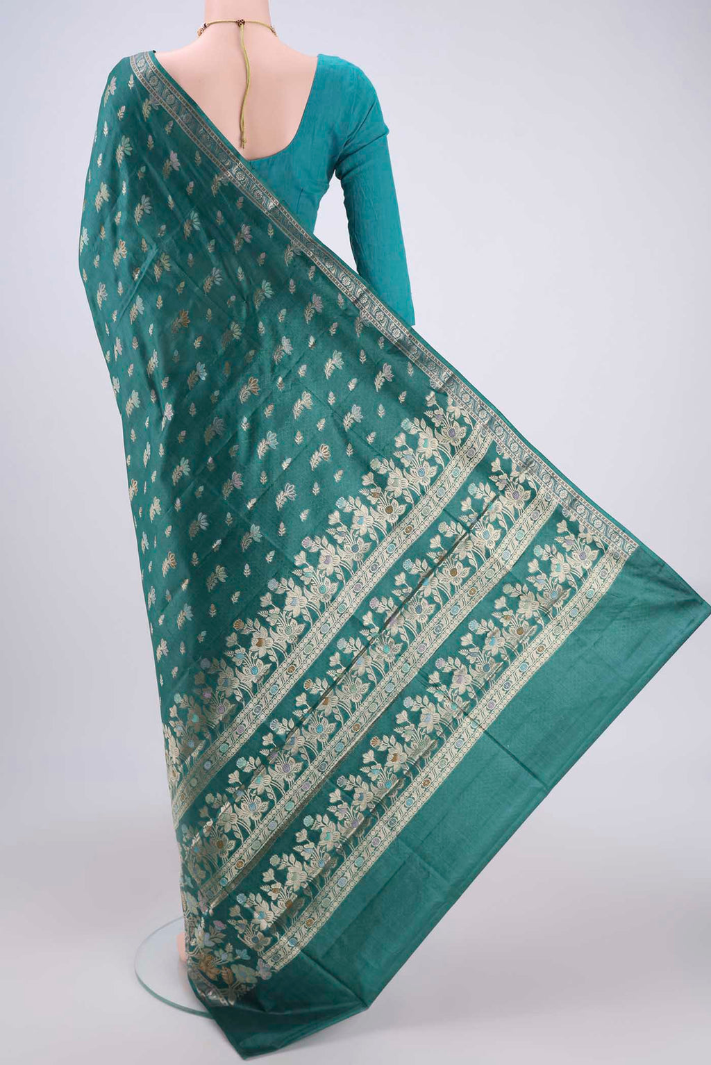 Flat view of Sea Green Banarasi Tussar Silk Saree with Zari And Thread Butta on the body and Zari And Thread Border. 