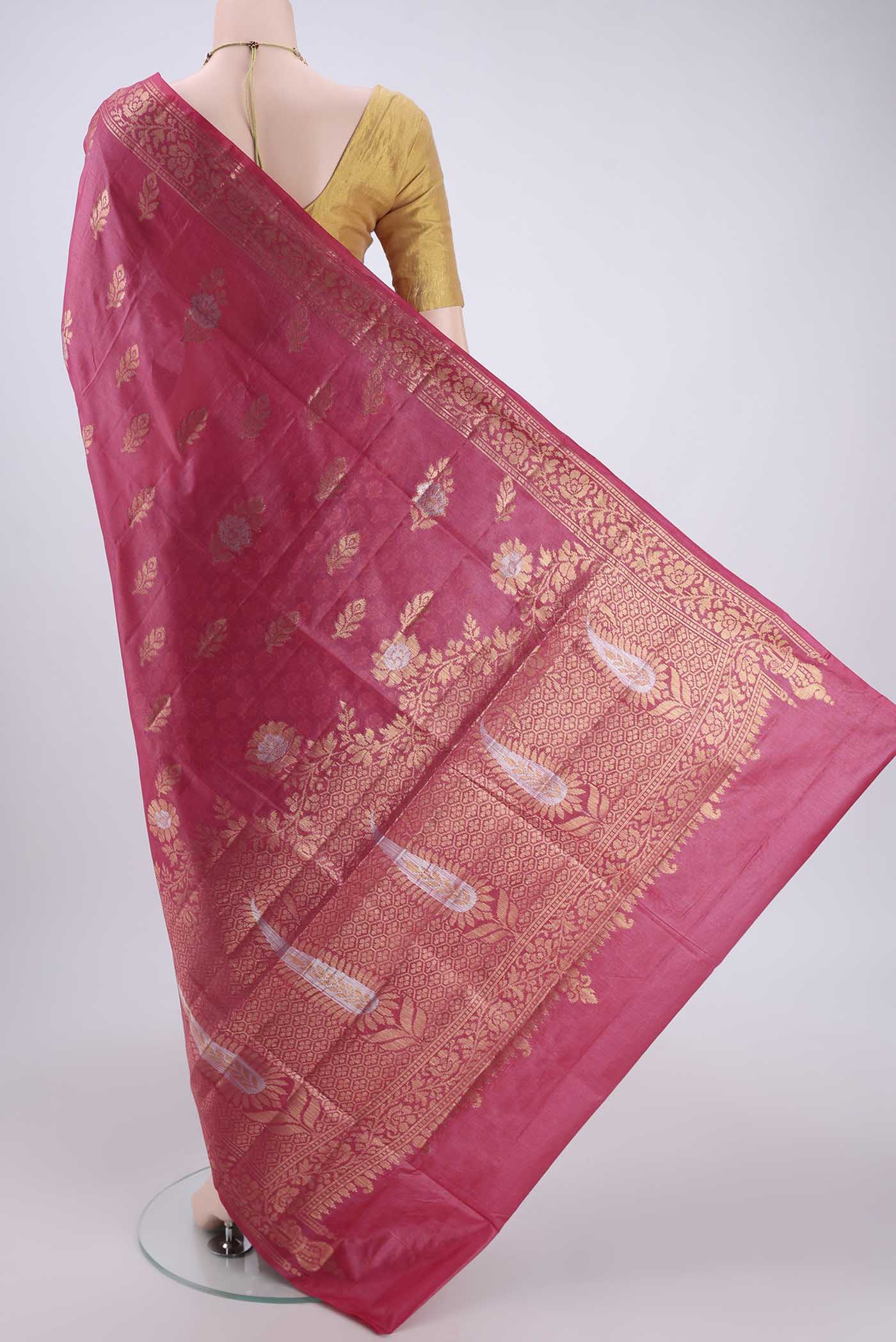 Flat view of Pink Banarasi Tussar Silk Saree with Zari And Thread Butta on the body and Zari And Thread Border. 