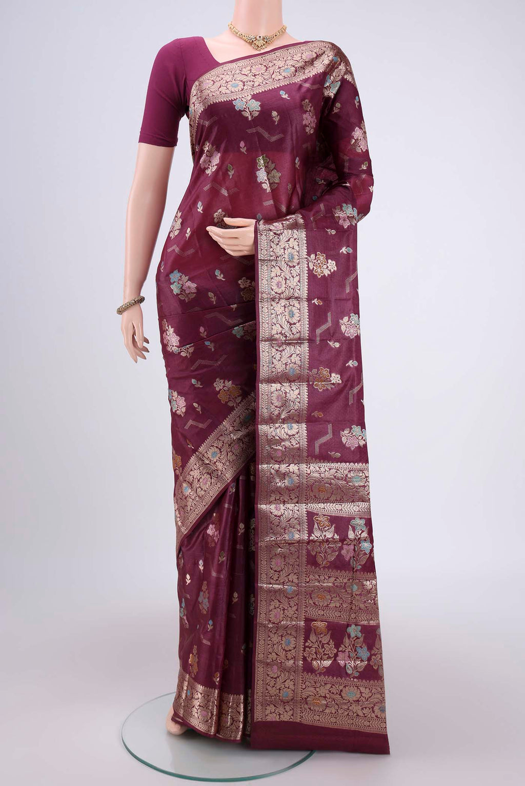 Purple Banarasi Tussar Silk Saree with Thread Brocade on the body and Zari And Thread Border.  displayed on a mannequin