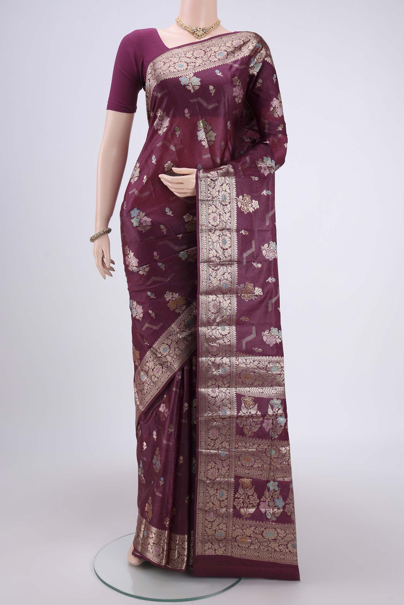Purple Banarasi Tussar Silk Saree with Thread Brocade on the body and Zari And Thread Border.  displayed on a mannequin