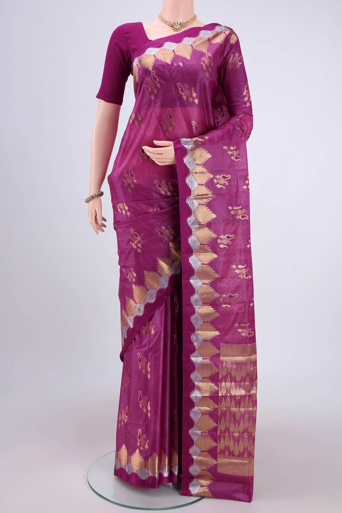 Magenta Banarasi Tussar Silk Saree with Zari And Thread Butta on the body and Zari And Thread Border.  displayed on a mannequin
