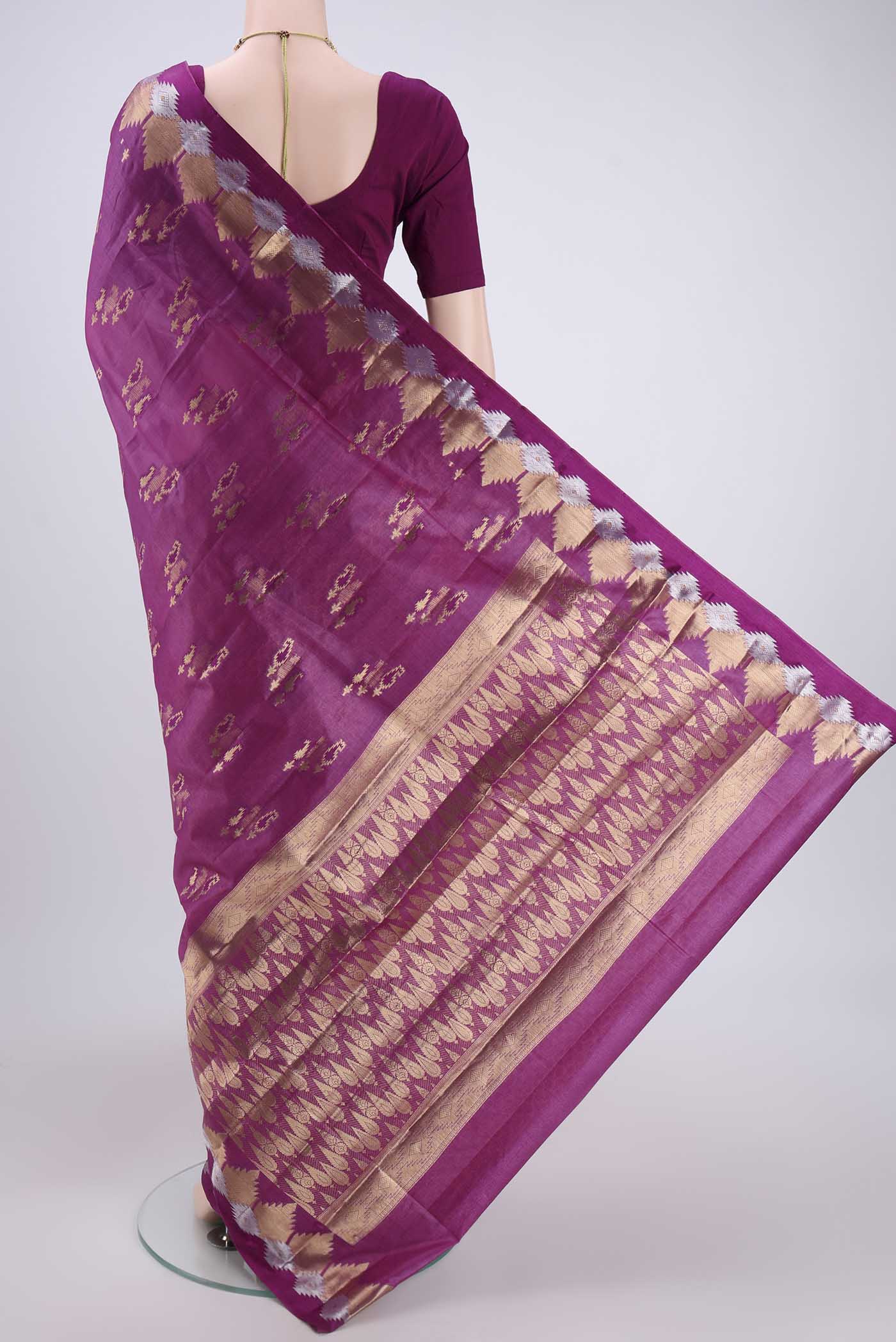 Flat view of Magenta Banarasi Tussar Silk Saree with Zari And Thread Butta on the body and Zari And Thread Border. 