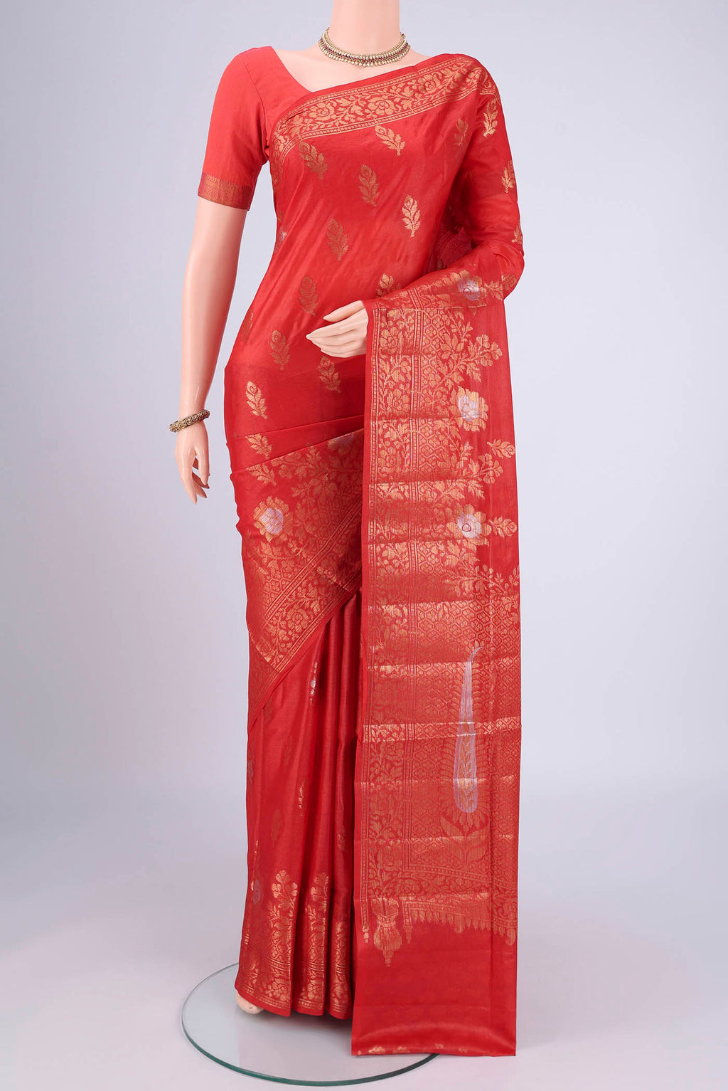 Imperial Red Banarasi Tussar Silk Saree with Zari Butta on the body and Zari Border.  displayed on a mannequin