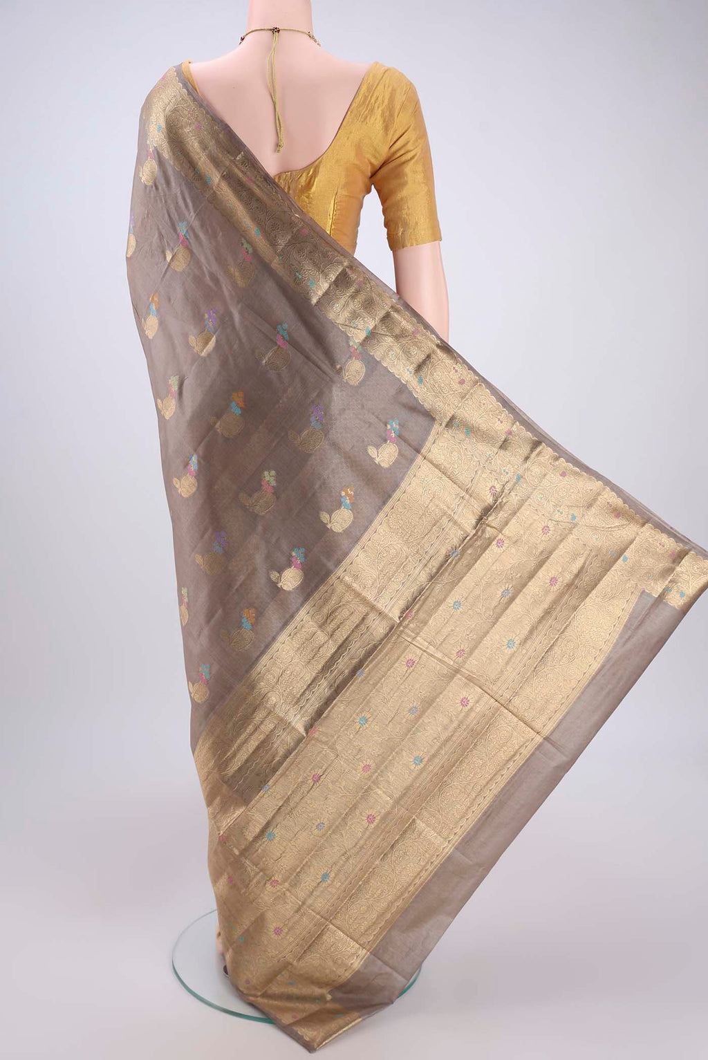 Flat view of Dark Beige Banarasi Tussar Silk Saree with Zari And Thread Butta on the body and Zari And Thread Border. 