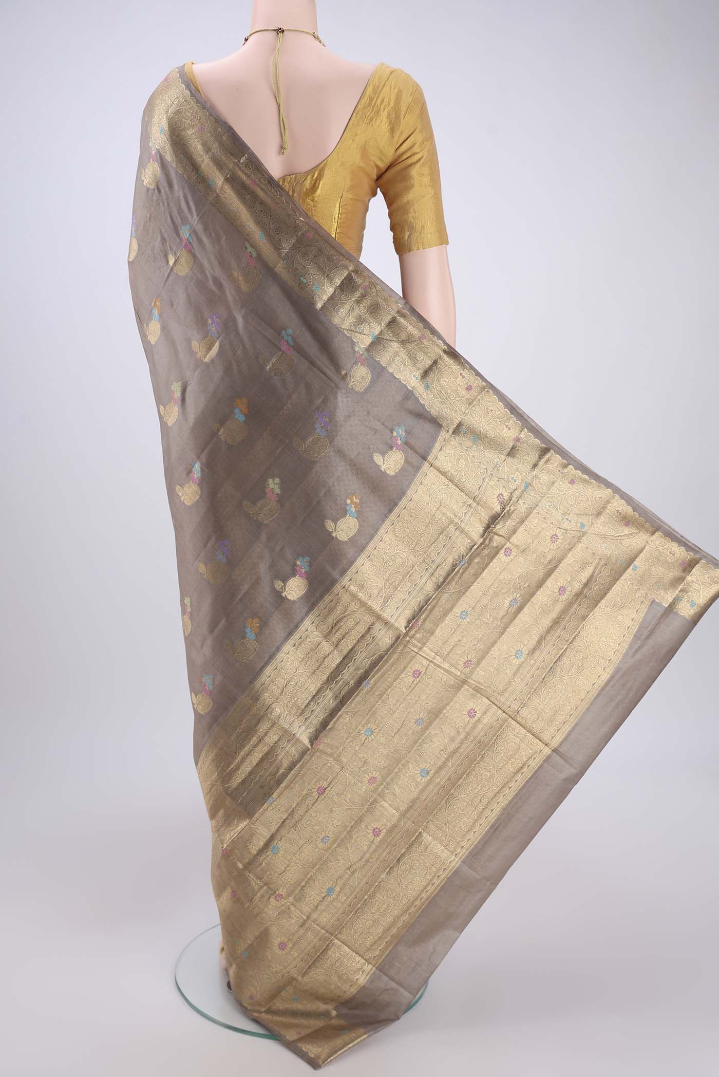 Flat view of Dark Beige Banarasi Tussar Silk Saree with Zari And Thread Butta on the body and Zari And Thread Border. 