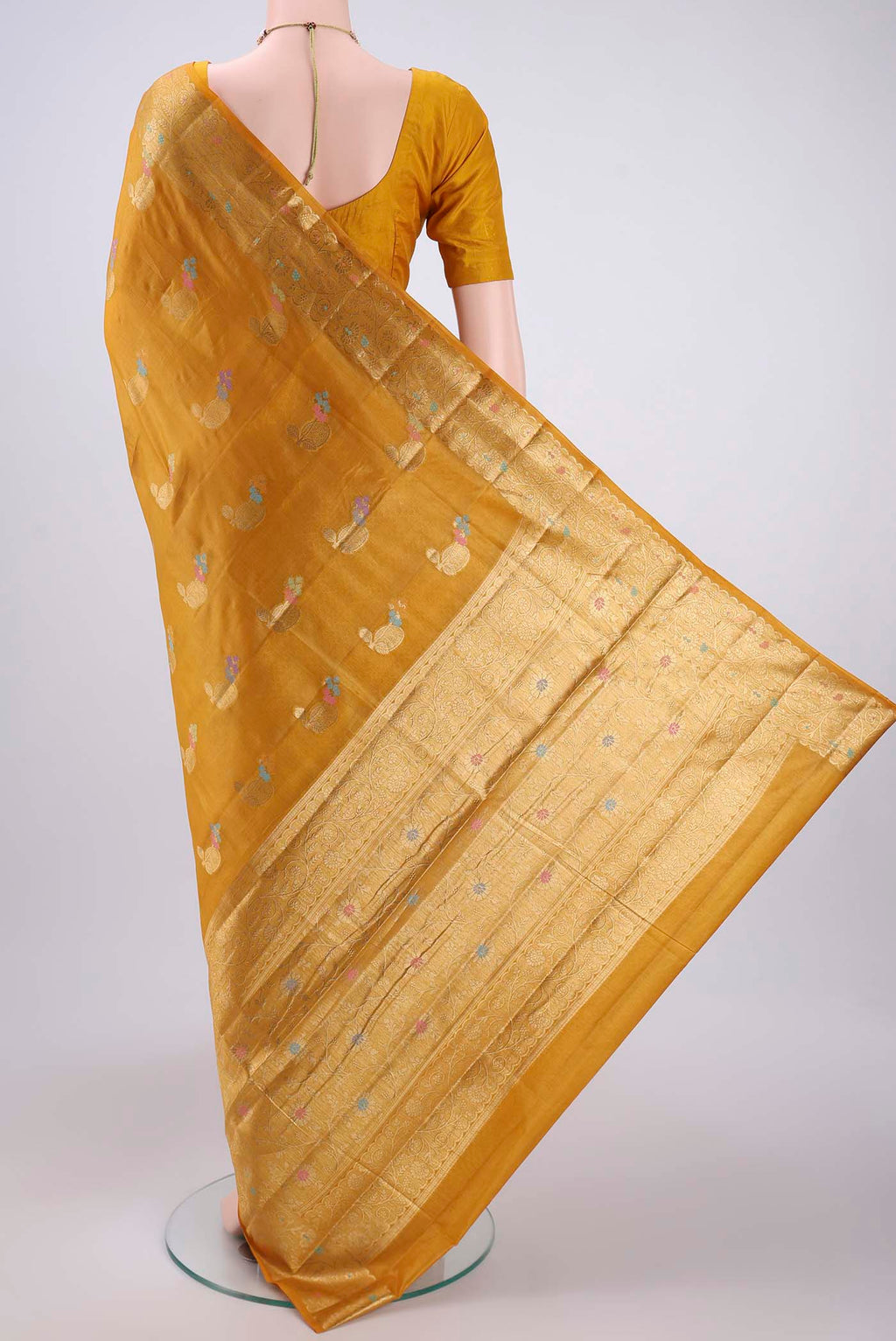 Flat view of Yellow Banarasi Tussar Silk Saree with Zari And Thread Butta on the body and Zari And Thread Border. 