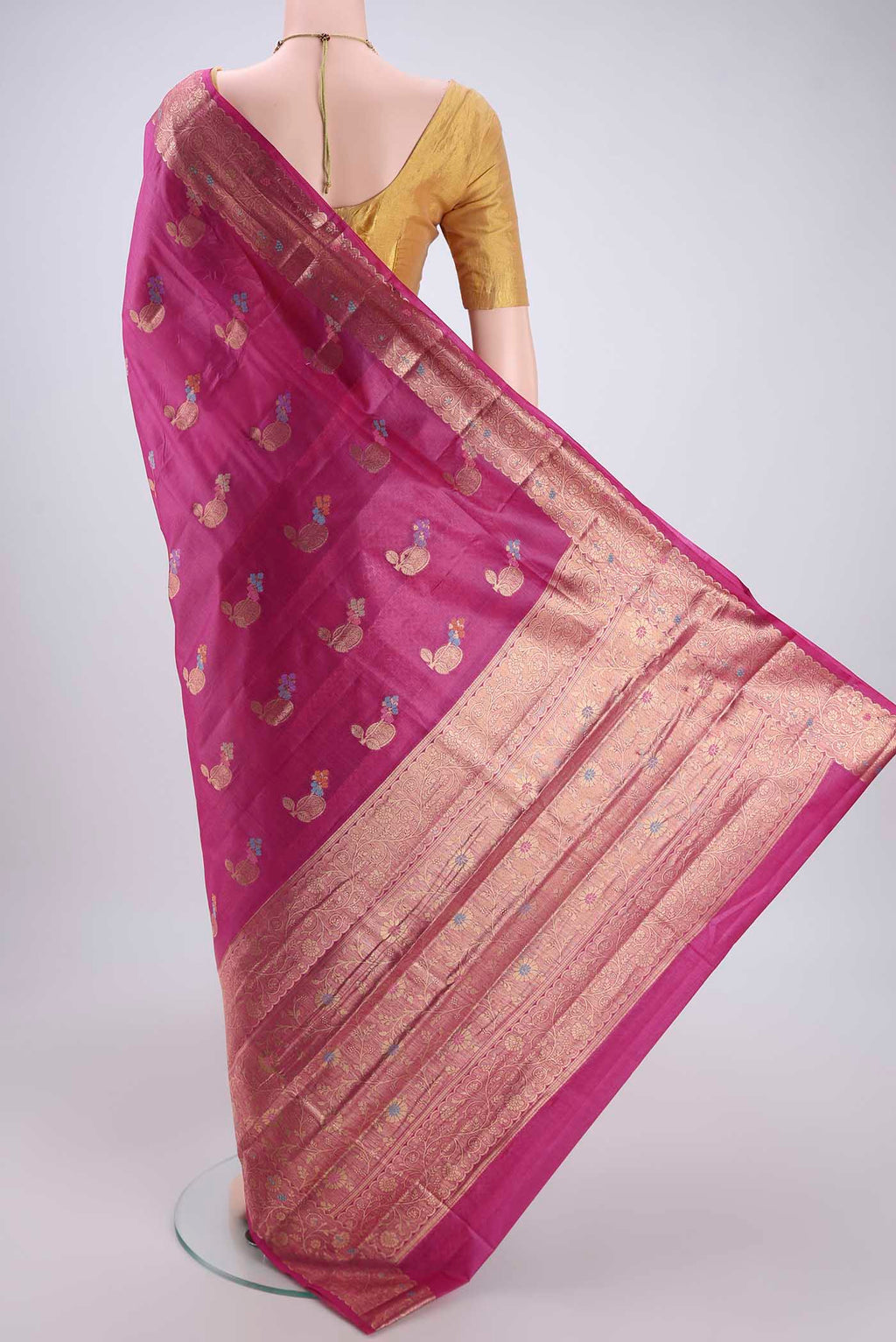 Flat view of Magenta Banarasi Tussar Silk Saree with Thread Brocade on the body and Zari And Thread Border. 