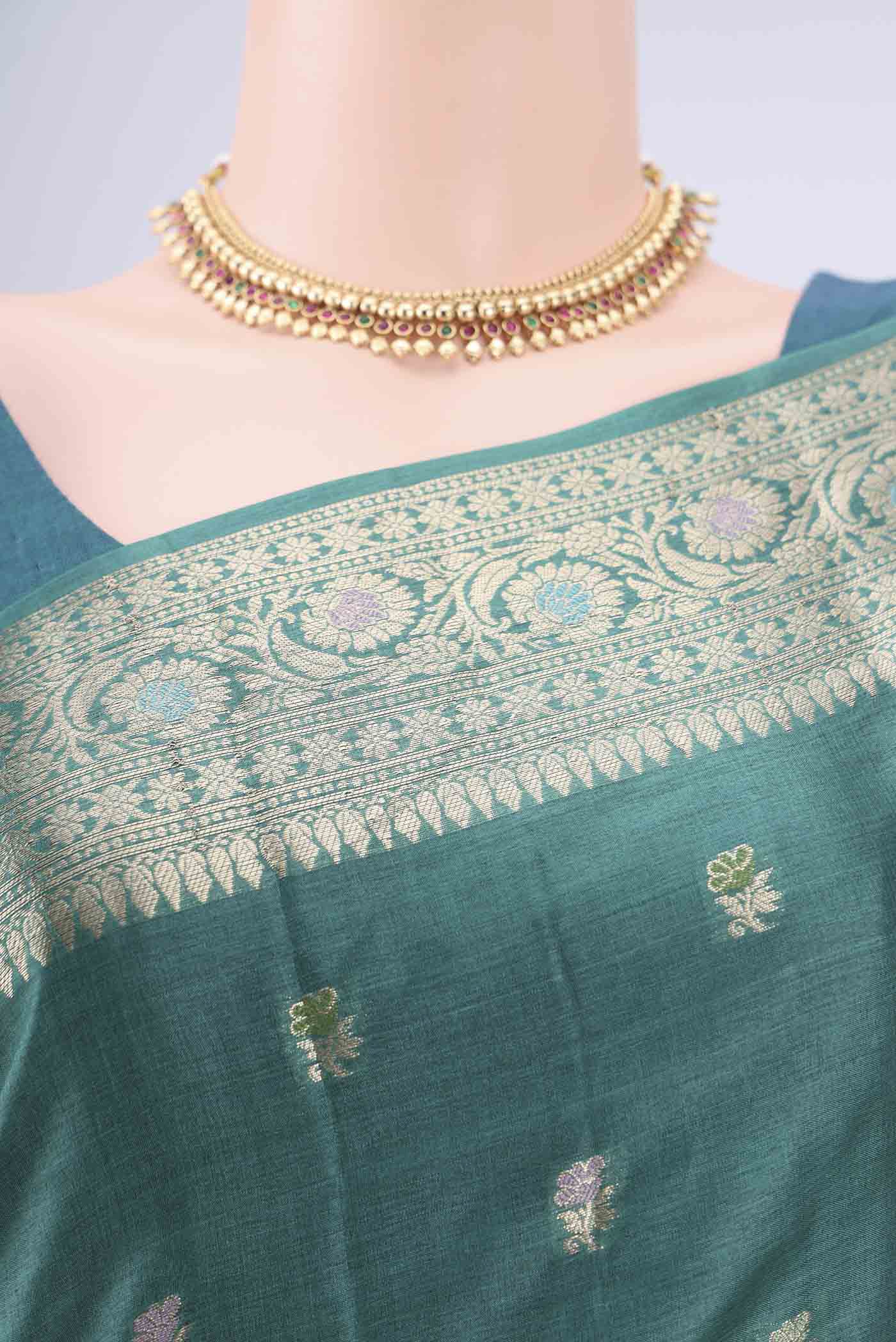 Border image of Green Banarasi Tussar Silk Saree with Zari Butta on the body and Zari And Thread Border. 