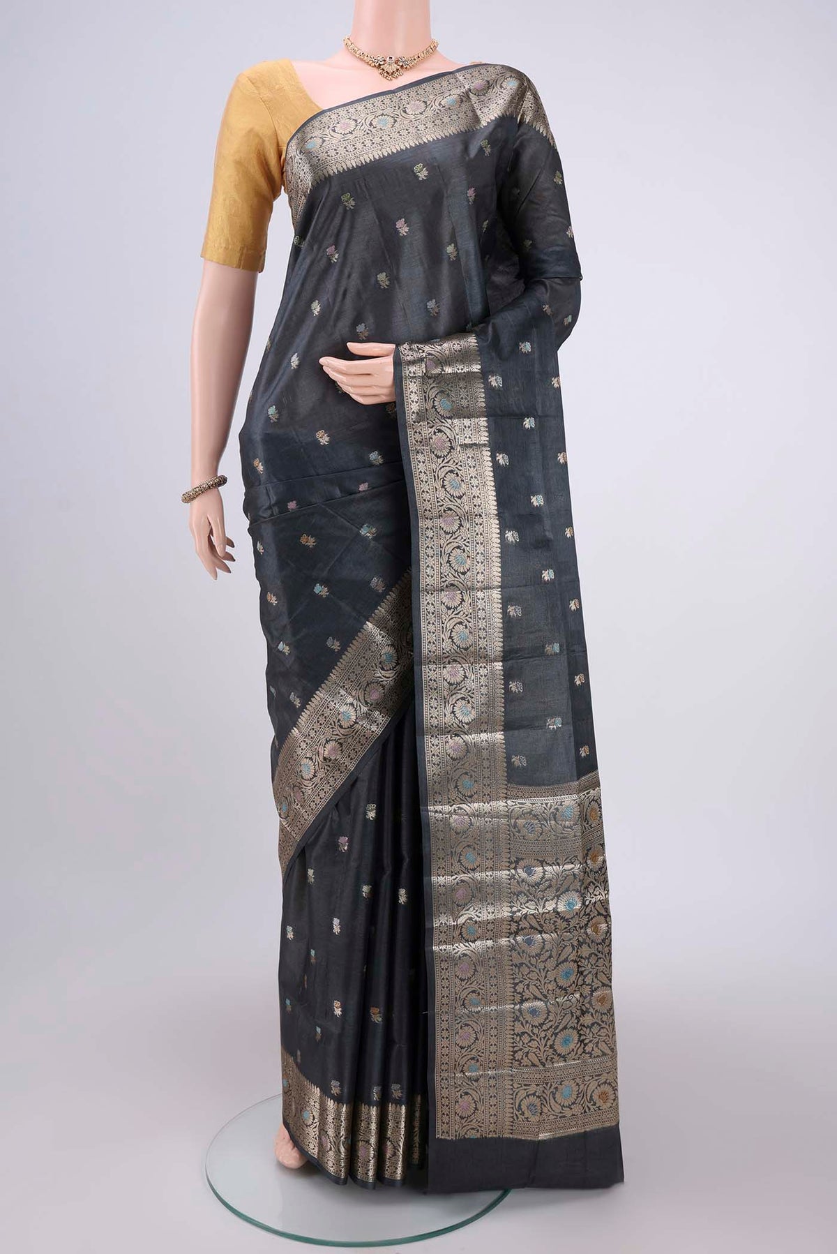 Grey Banarasi Tussar Silk Saree with Thread Brocade on the body and Zari And Thread Border.  displayed on a mannequin