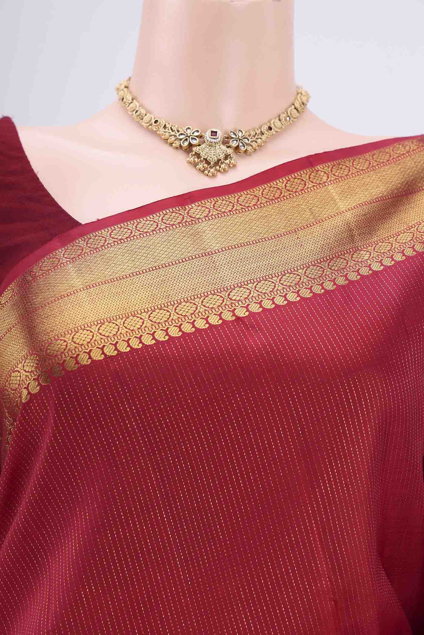 Border image of Maroon Dual Tone Kanchipuram Silk Saree with Checked design on the body and Attached Border. 