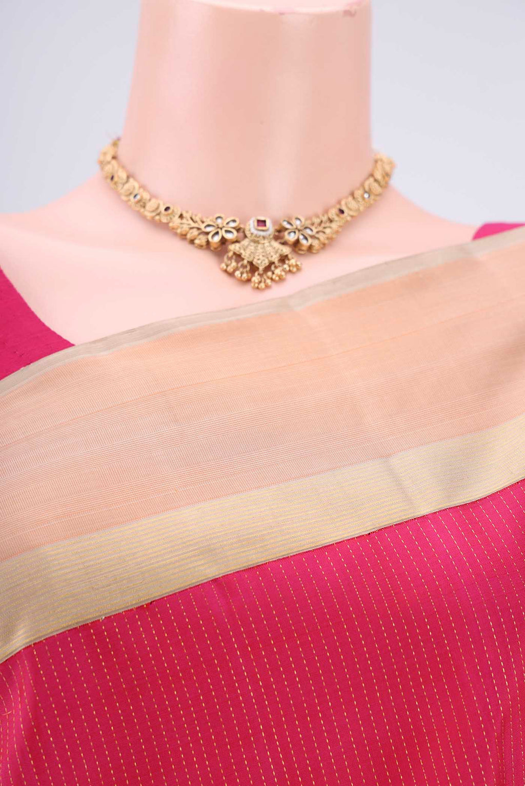 Border image of Pure Silk Pure Zari Rani Pink Dual Tone Kanjivaram Saree with Stripes on the body and Zari Border. 
