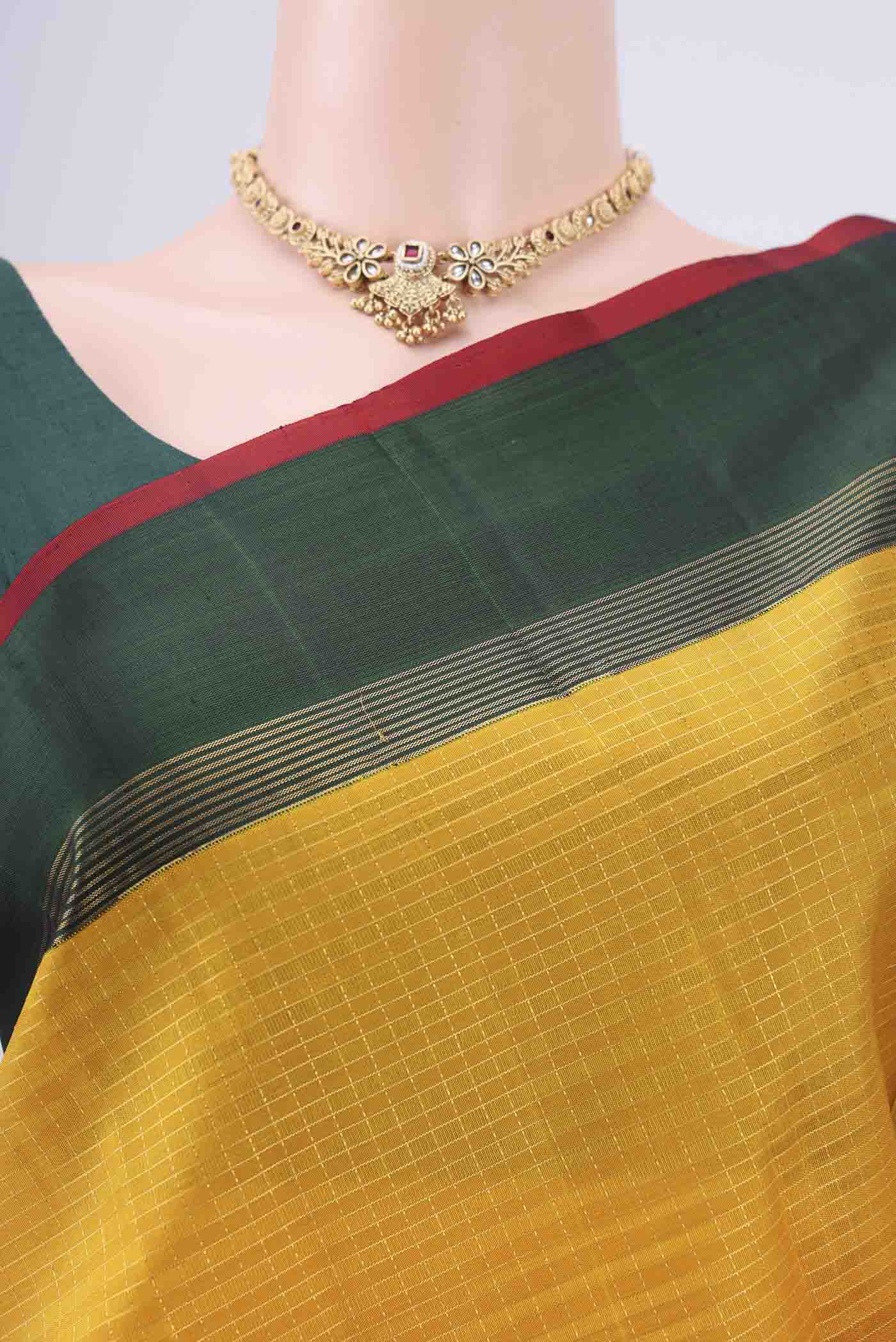 Border image of Pure Silk Pure Zari Yellow Kanjivaram Saree with Checked design on the body and Zari Border. 