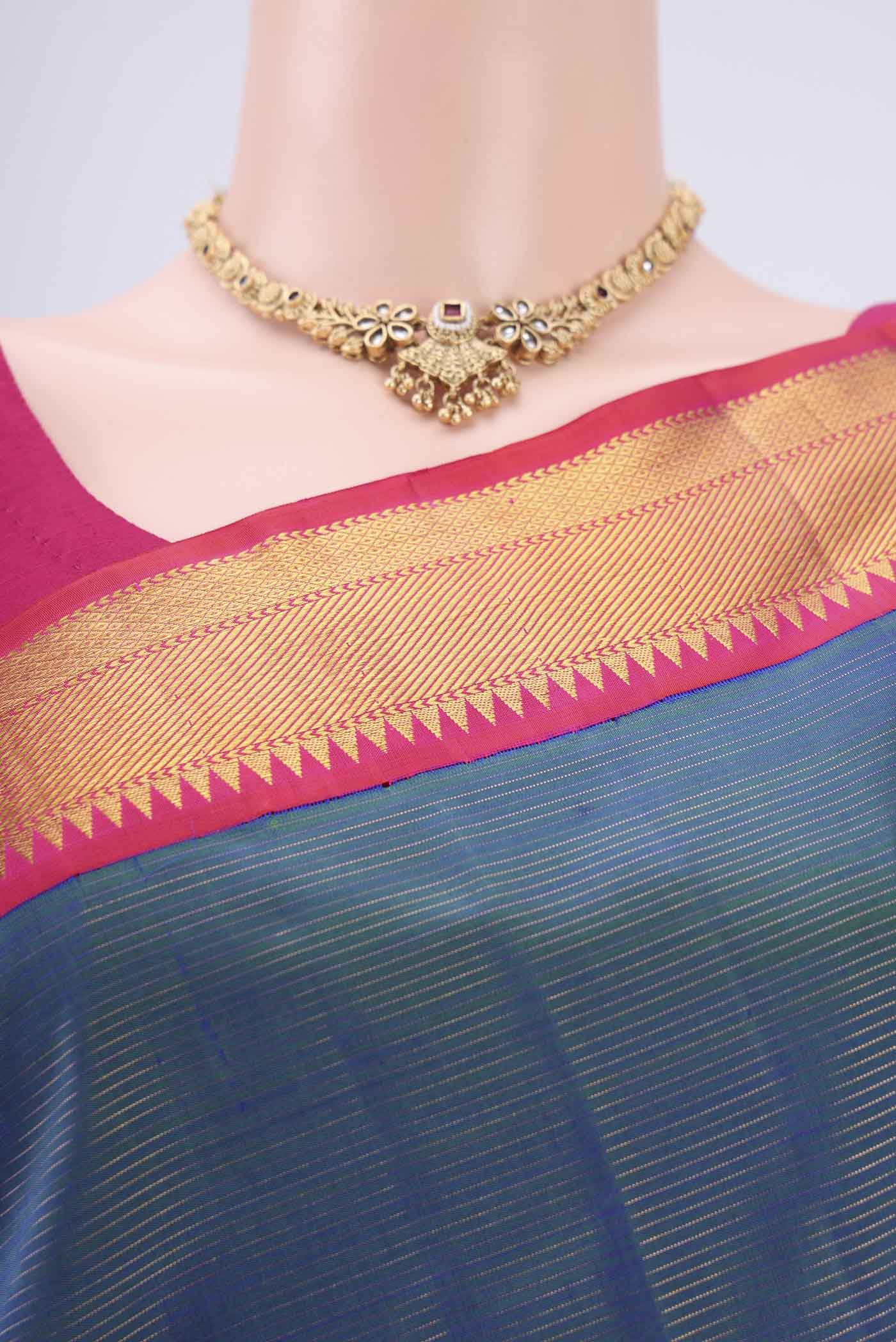 Border image of Pure Silk Pure Zari Peacock Blue Dual Tone Kanchipuram Saree with Stripes on the body and Temple Border. 