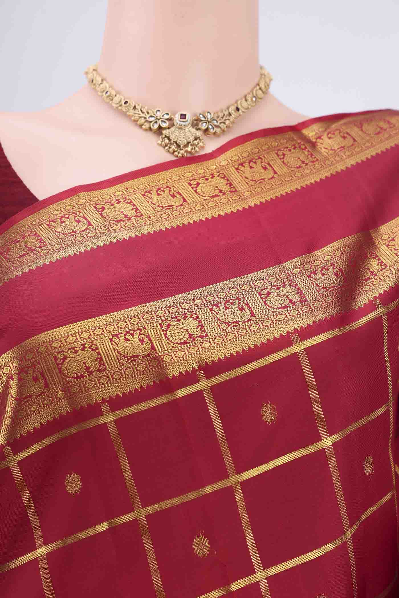Border image of Pure Silk Pure Zari Maroon Kanchipuram Saree with Checked design on the body and Zari Border. 