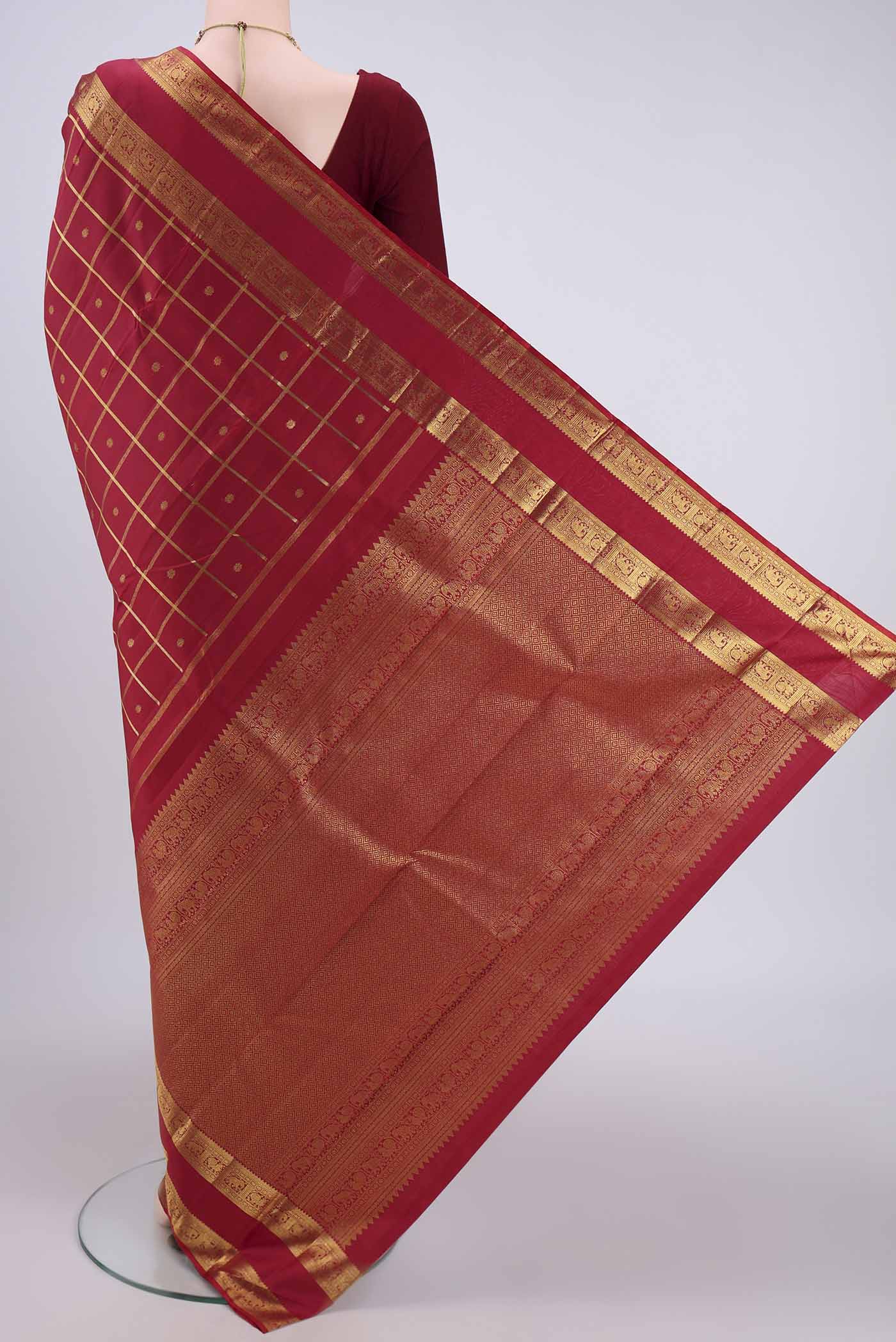Flat view of Pure Silk Pure Zari Maroon Kanchipuram Saree with Checked design on the body and Zari Border. 