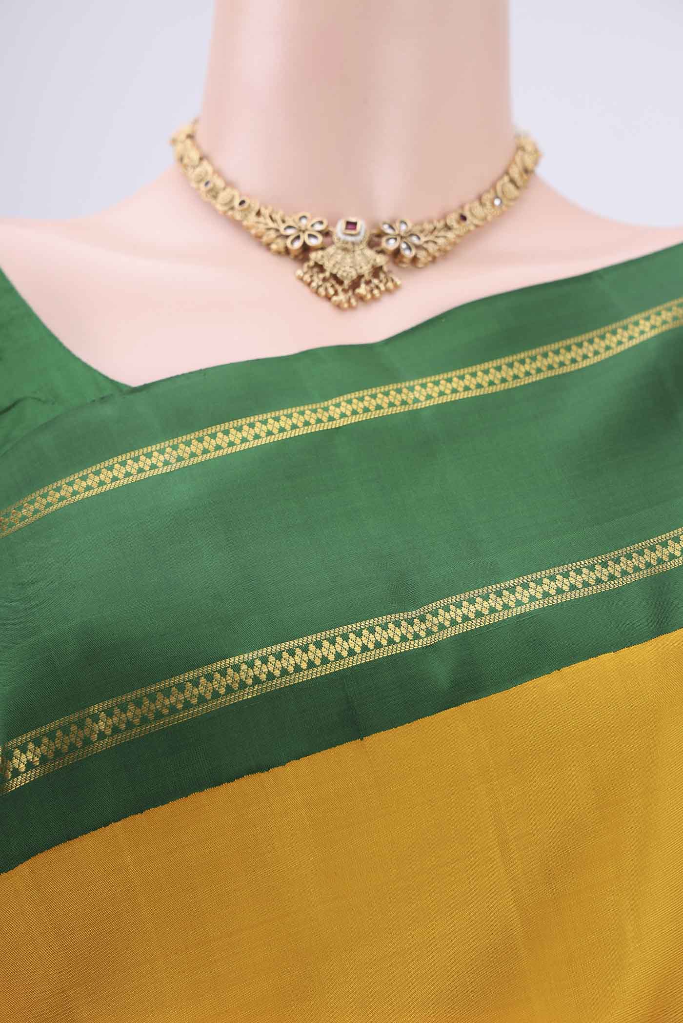 Border image of Pure Silk Pure Zari Mustard Kanjivaram Saree with Plain Body and Temple Border. 