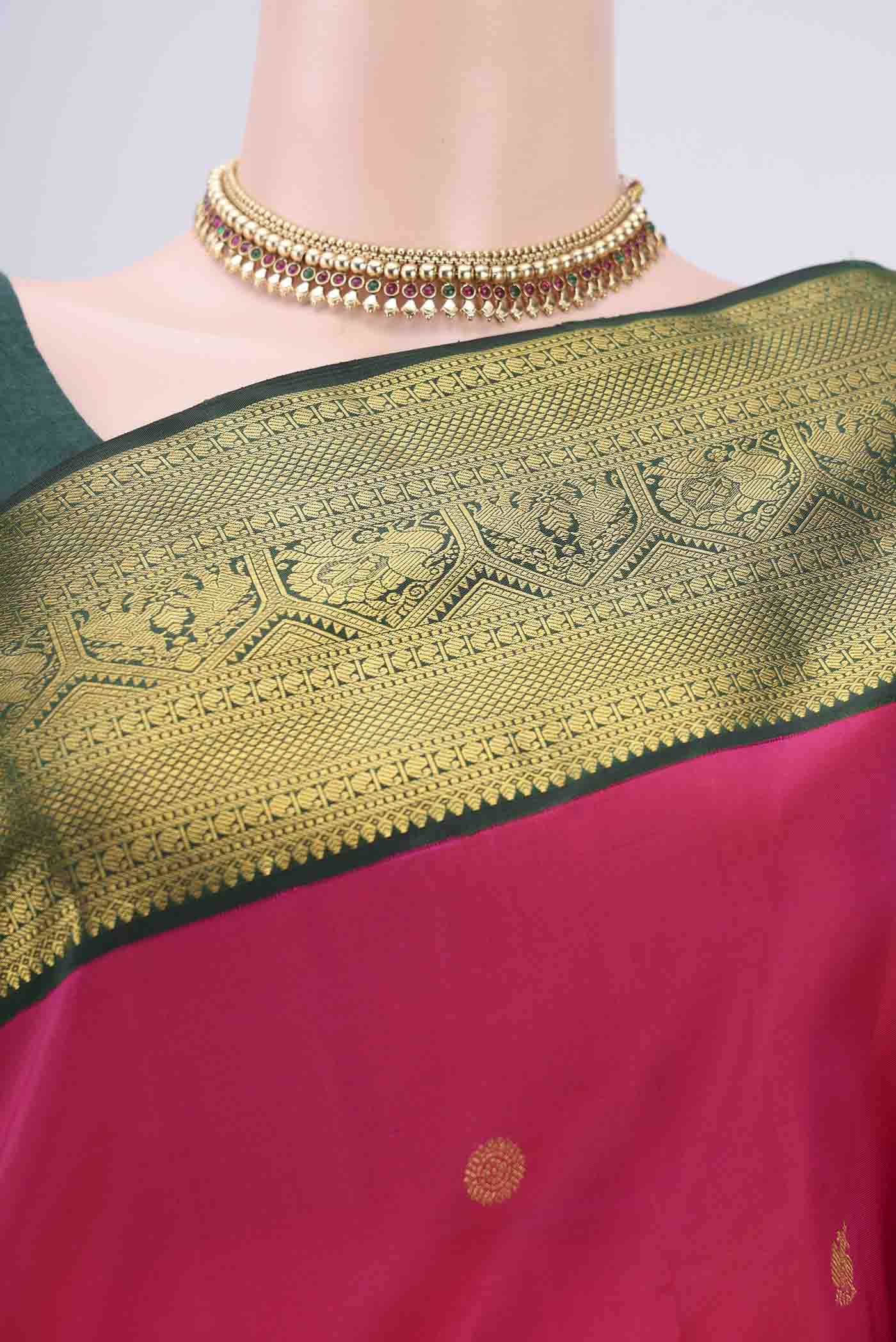 Border image of Pure Silk Pure Zari Rani Pink Kanchipuram Saree with Zari Butta on the body and Zari Border. 