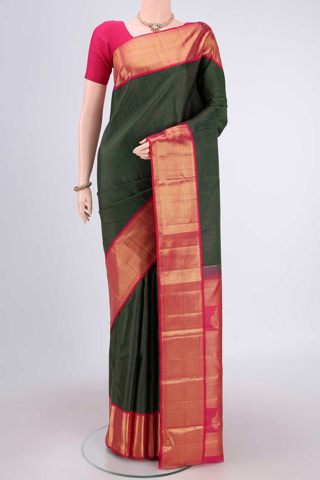Pure Silk Pure Zari Bottle Green Kanchipuram Saree with Checked design on the body and Zari Border.  displayed on a mannequin