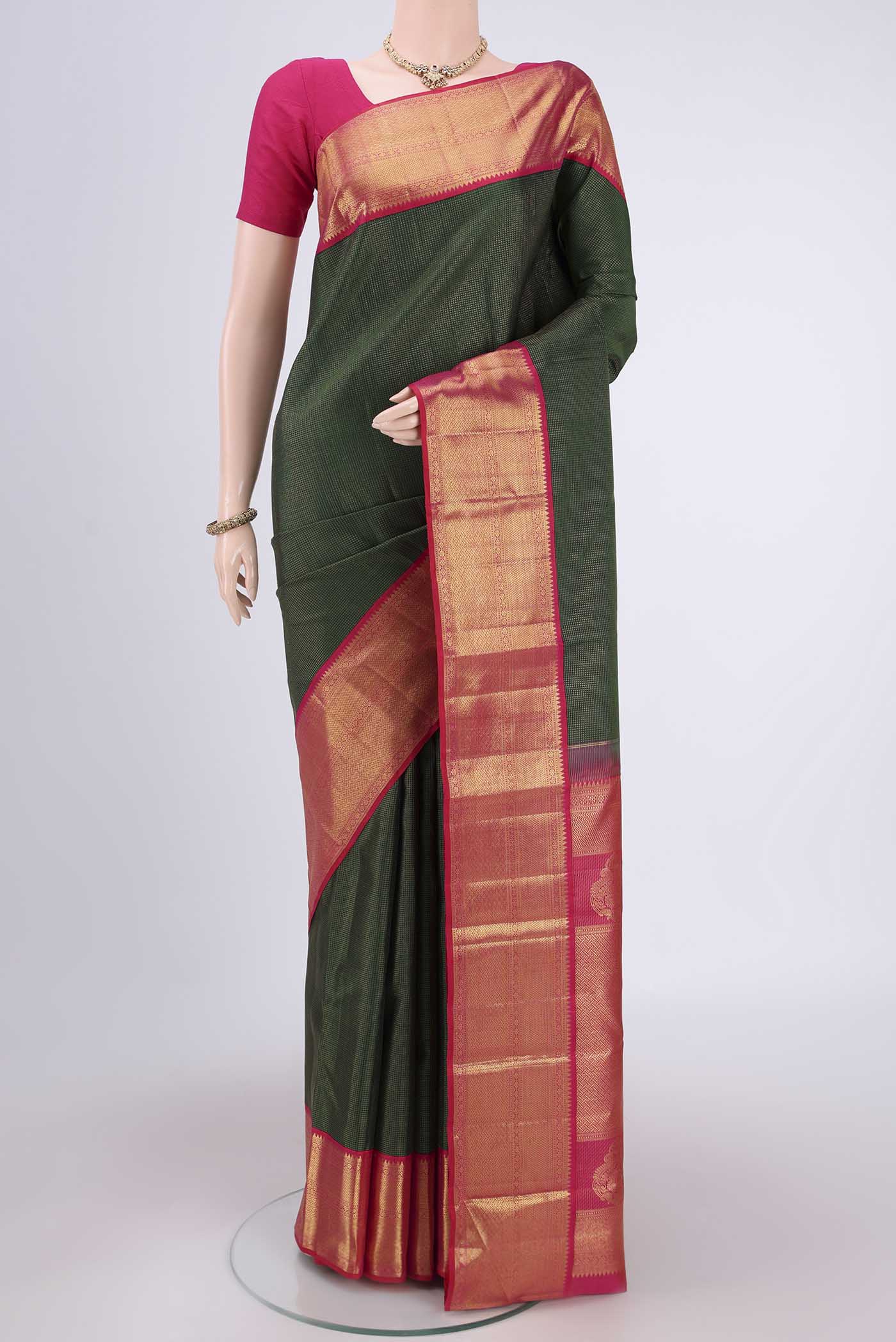 Pure Silk Pure Zari Bottle Green Kanchipuram Saree with Checked design on the body and Zari Border.  displayed on a mannequin