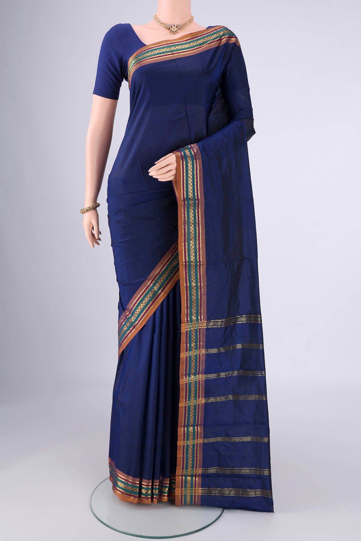 Navy Blue Blended Bangalore Silk Saree with Jacquard design on the body and Zari Border.  displayed on a mannequin