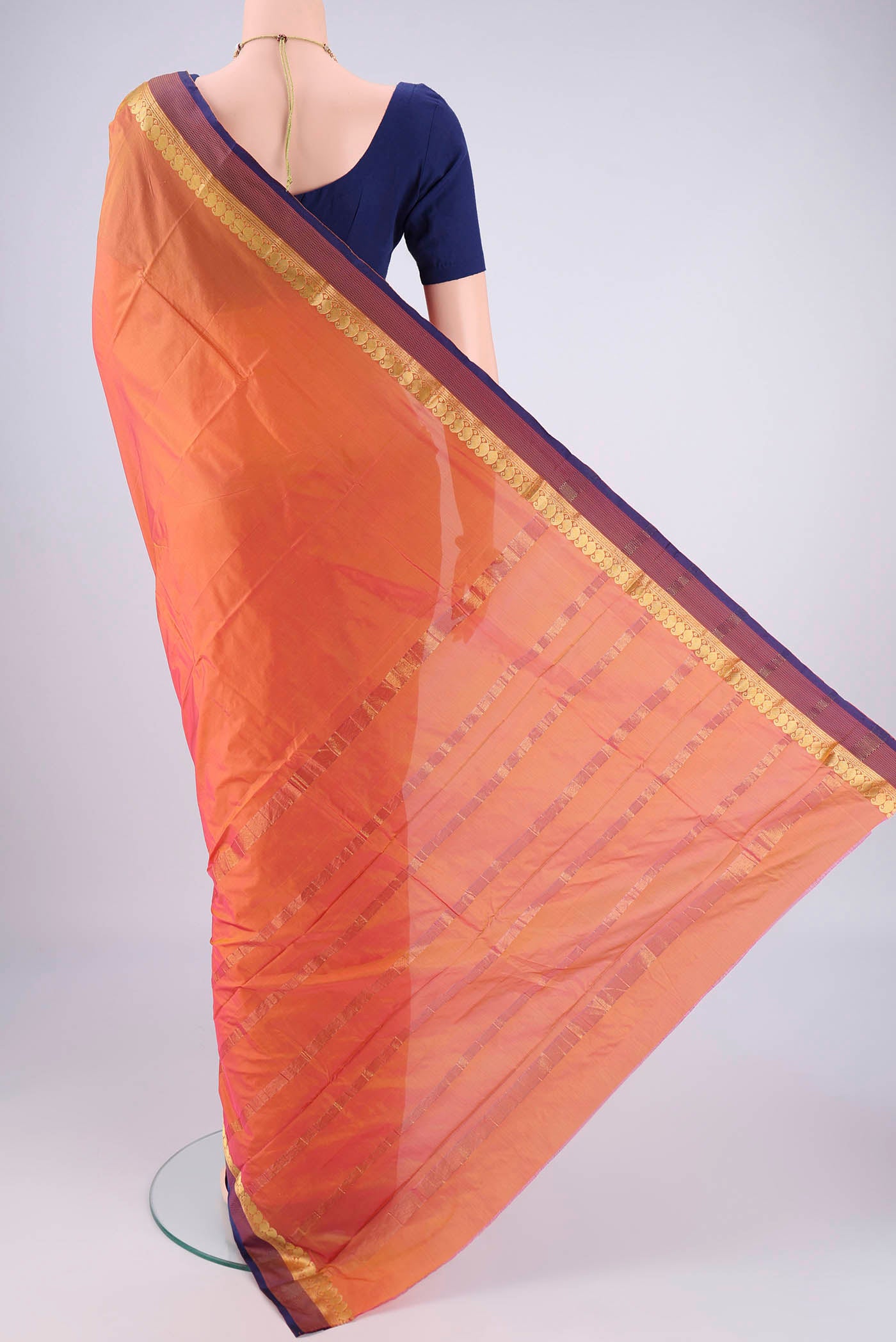 Flat view of Brick Orange Blended Bangalore Silk Saree with Plain Body and Zari Border. 