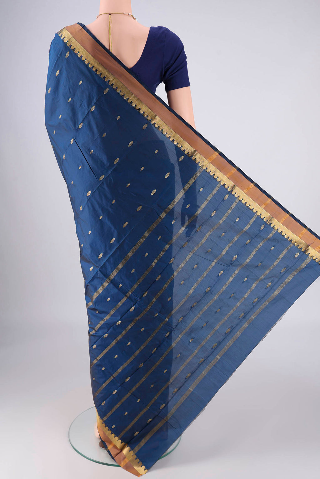 Flat view of Dark Blue Blended Bangalore Silk Saree with Zari Butta on the body and Zari Border. 