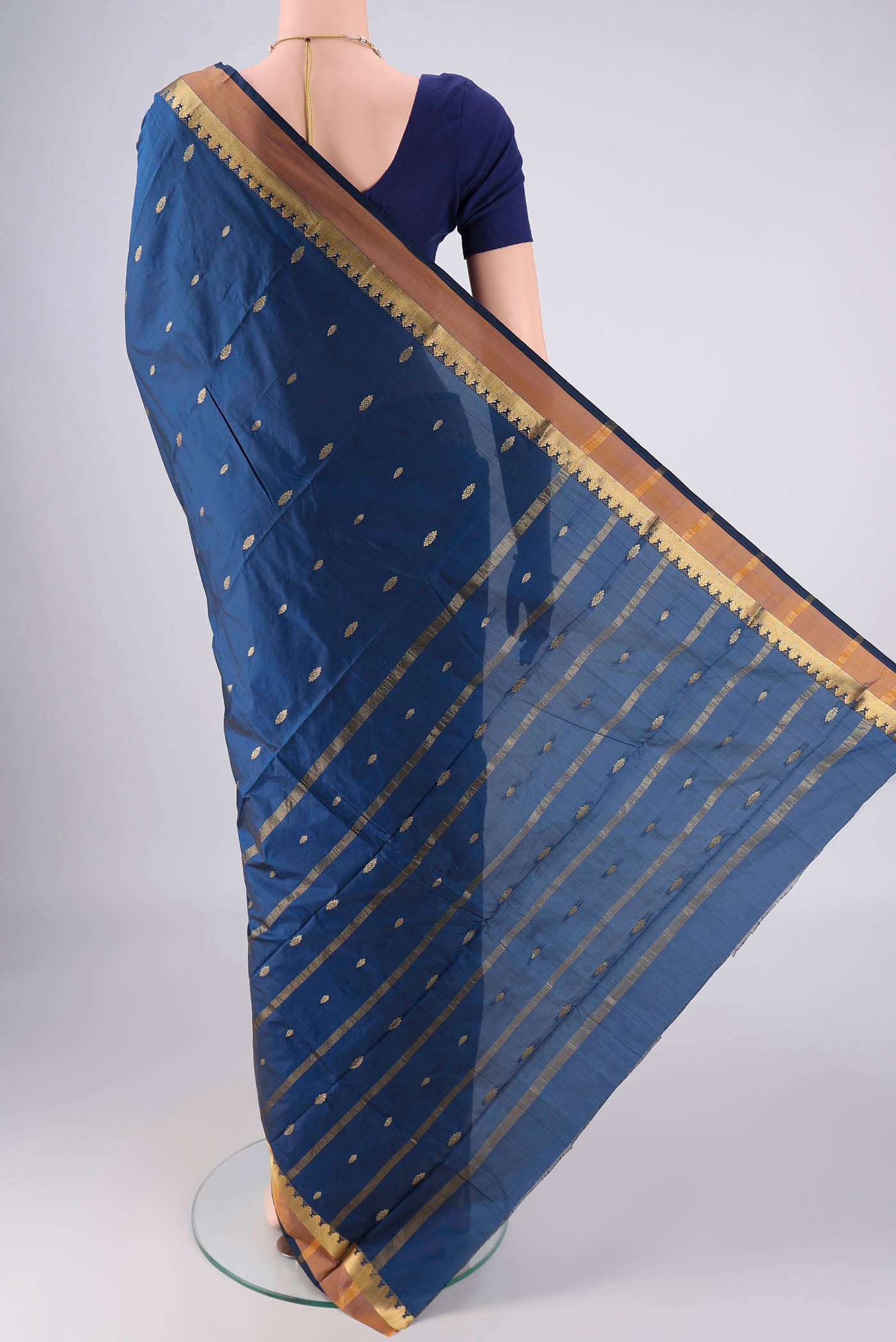 Flat view of Dark Blue Blended Bangalore Silk Saree with Zari Butta on the body and Zari Border. 