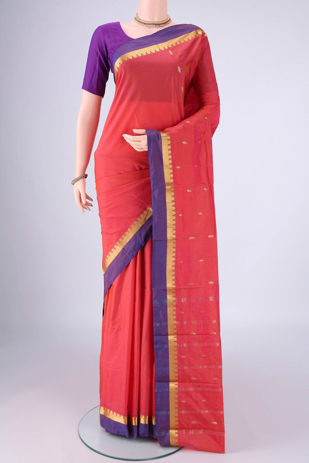 Coral Blended Bangalore Silk Saree with Zari Butta on the body and Zari Border.  displayed on a mannequin