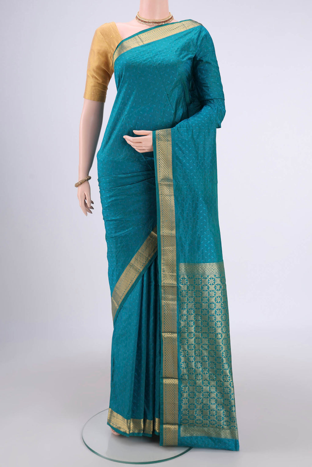 Sea Green Dual Tone Bangalore Silk Saree with Jacquard design on the body and Zari Border.  displayed on a mannequin