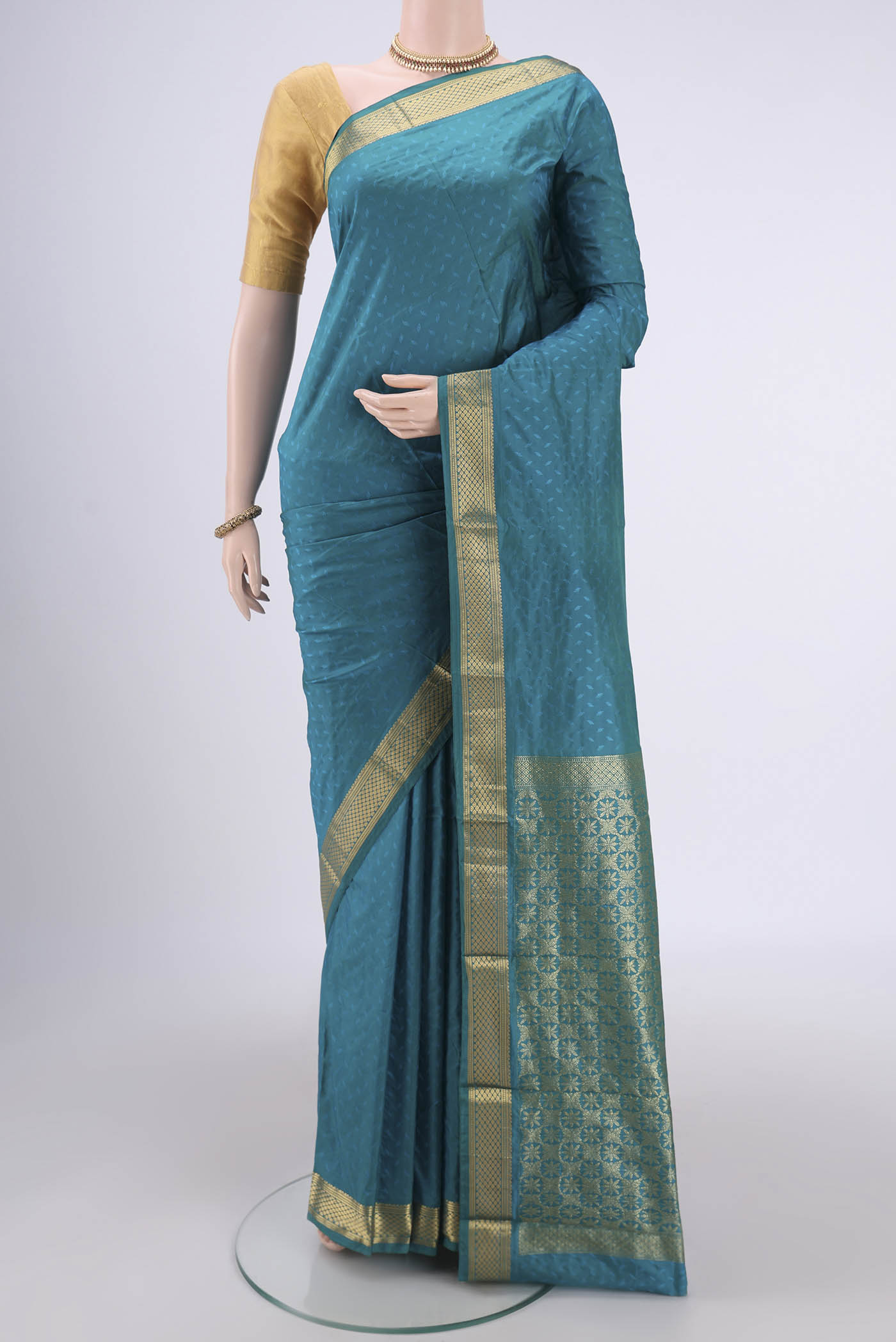 Sea Green Dual Tone Bangalore Silk Saree with Jacquard design on the body and Zari Border.  displayed on a mannequin
