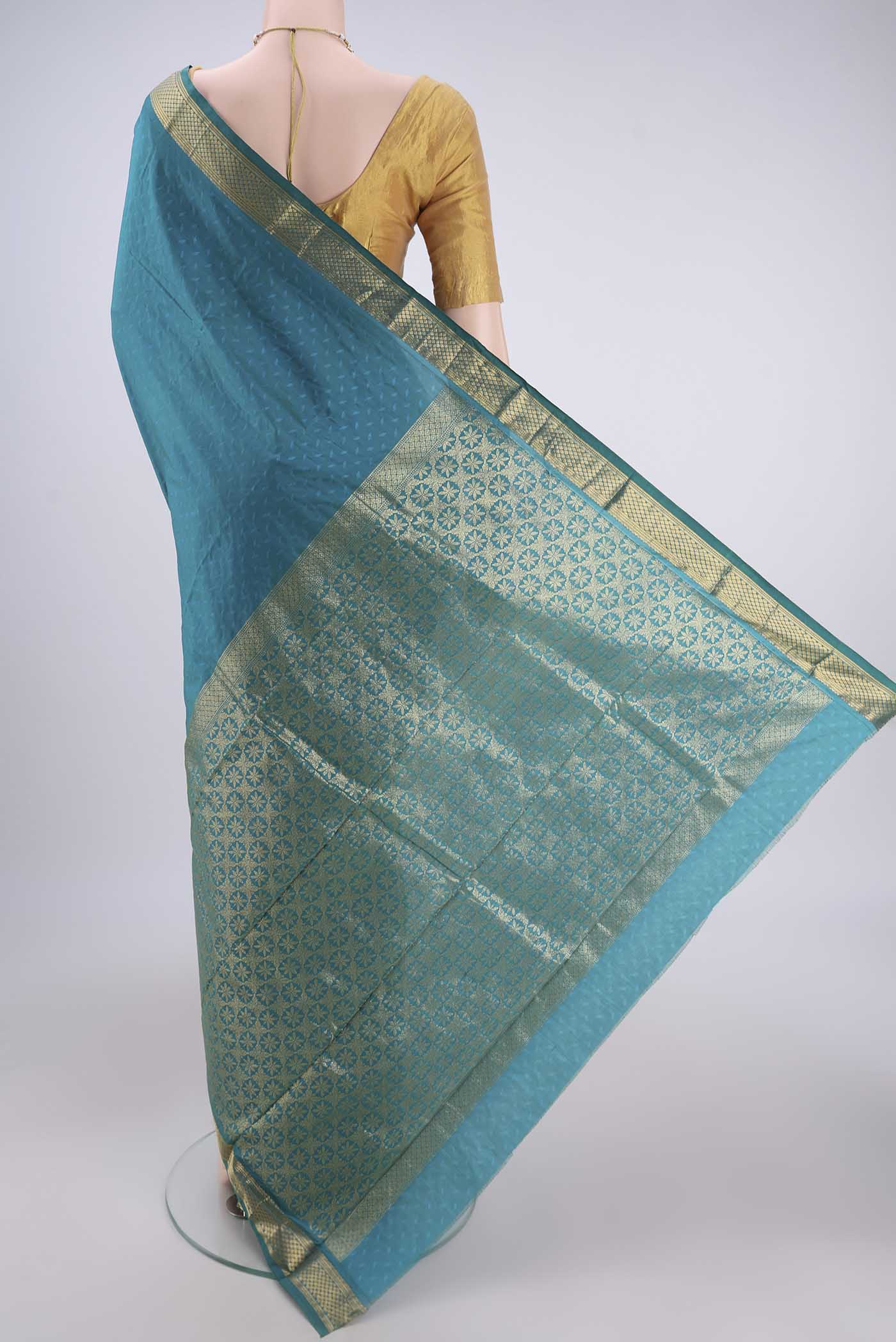 Flat view of Sea Green Dual Tone Bangalore Silk Saree with Jacquard design on the body and Zari Border. 