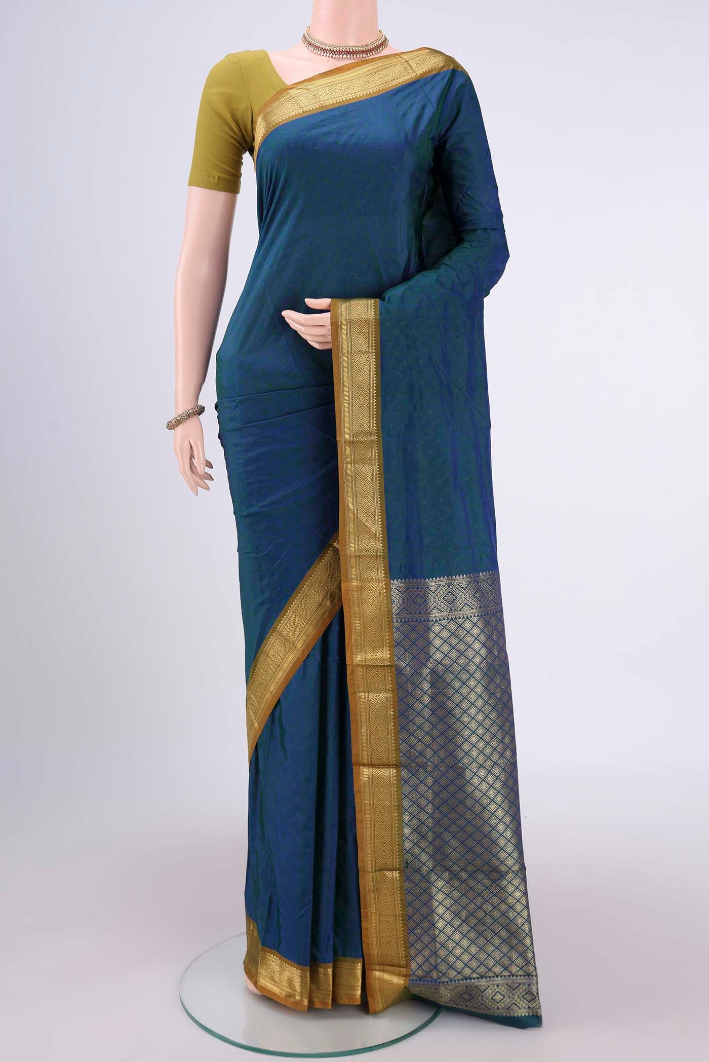 Peacock Blue Dual Tone Bangalore Silk Saree with Jacquard design on the body and Zari Border.  displayed on a mannequin