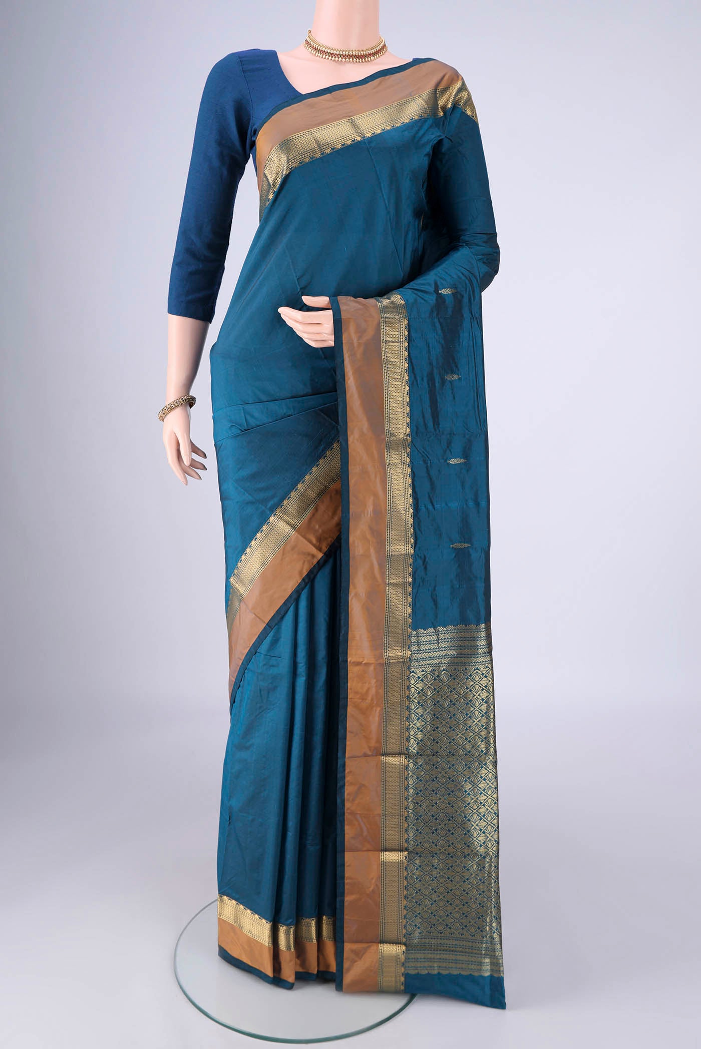 Blue Blended Bangalore Silk Saree with Zari Butta on the body and Zari Border.  displayed on a mannequin
