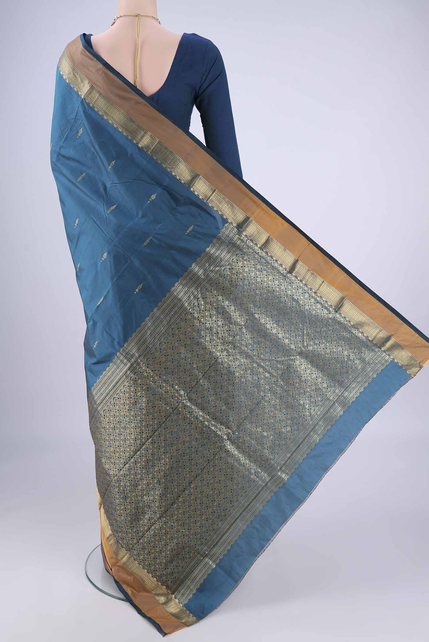 Flat view of Blue Blended Bangalore Silk Saree with Zari Butta on the body and Zari Border. 