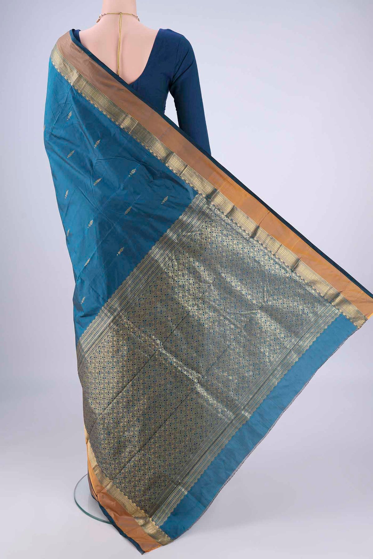 Flat view of Blue Blended Bangalore Silk Saree with Zari Butta on the body and Zari Border. 