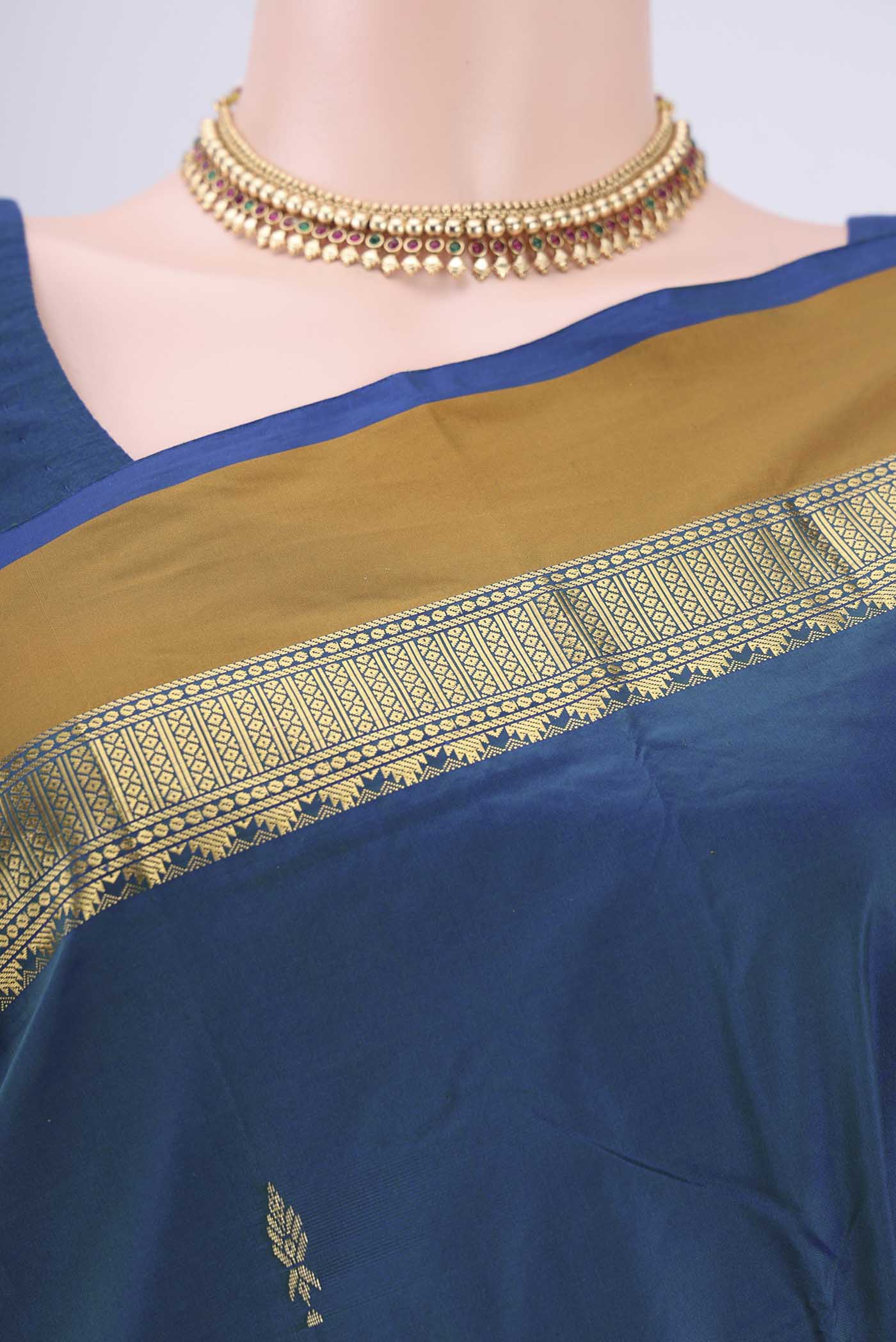Border image of Peacock Blue Blended Bangalore Silk Saree with Zari Butta on the body and Zari Border. 