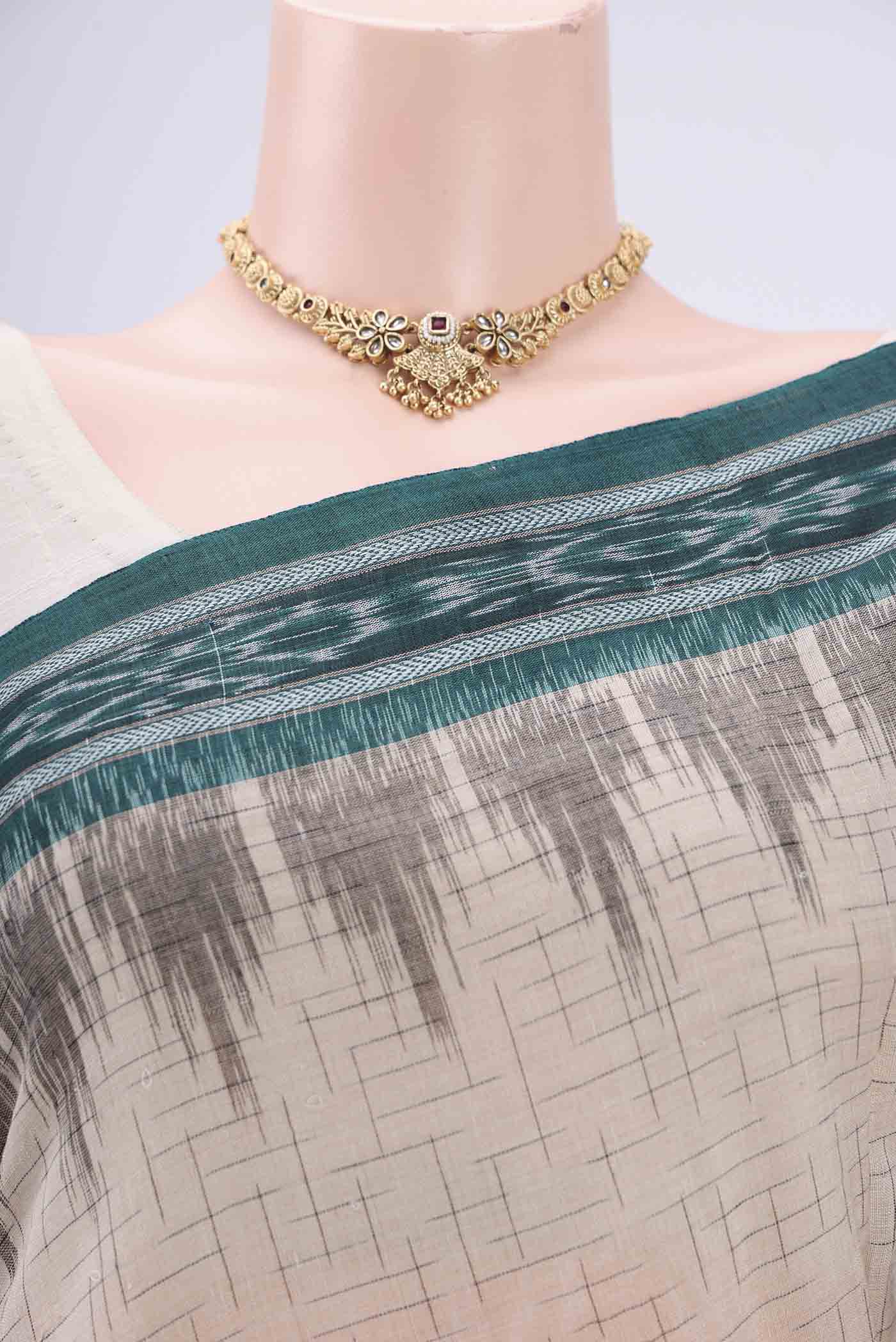Border image of Beige Pochampally Cotton Saree with Ikat design on the body and Ikat Border. 