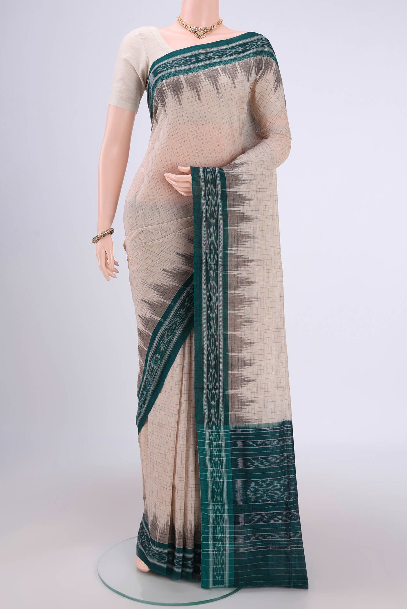 Beige Pochampally Cotton Saree with Ikat design on the body and Ikat Border.  displayed on a mannequin